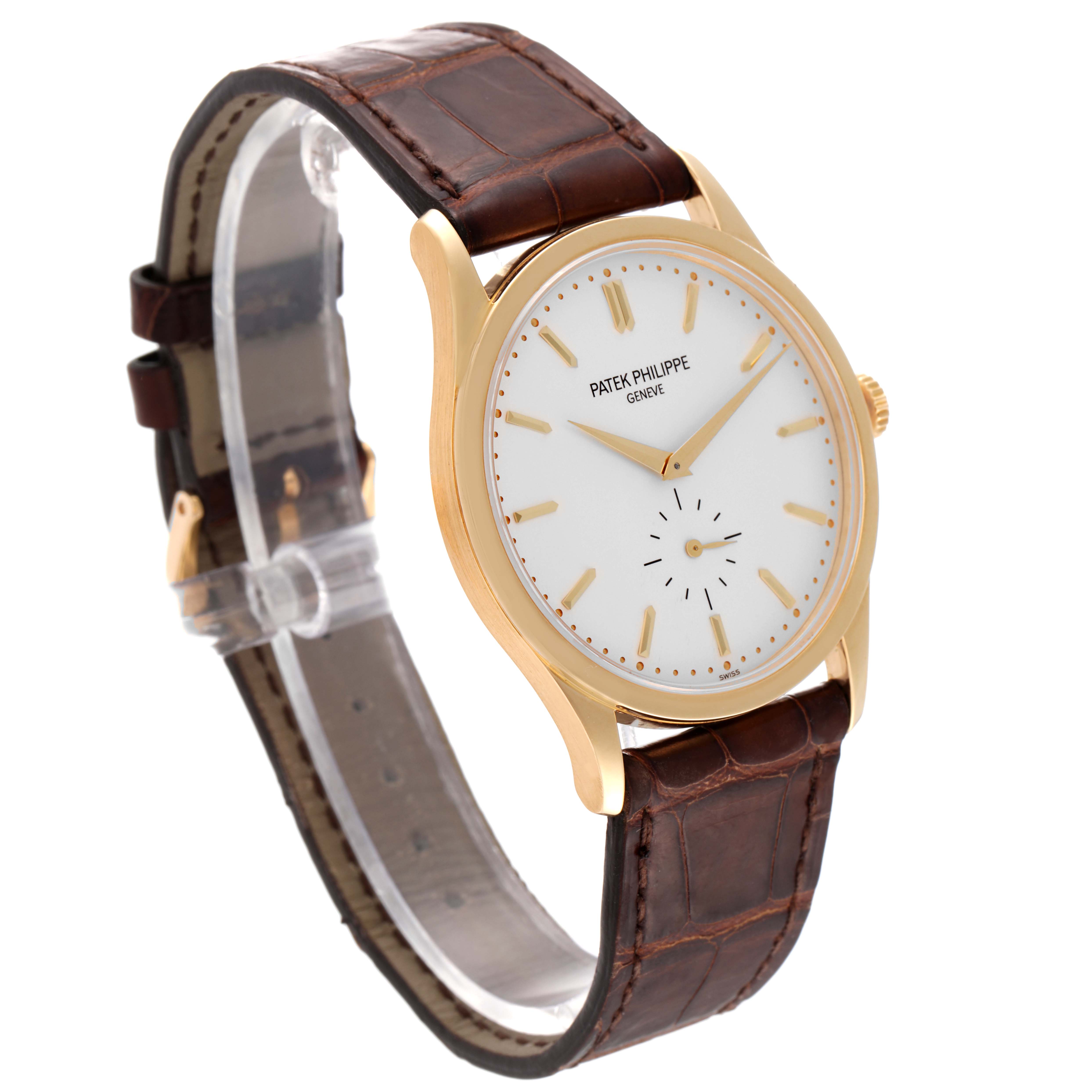 The image shows the Patek Philippe Calatrava 5196J Men's Yellow Gold Silver Dial 5196J Men's Yellow Gold Silver Dial watch at a slight angle, displaying its face, strap, and case.