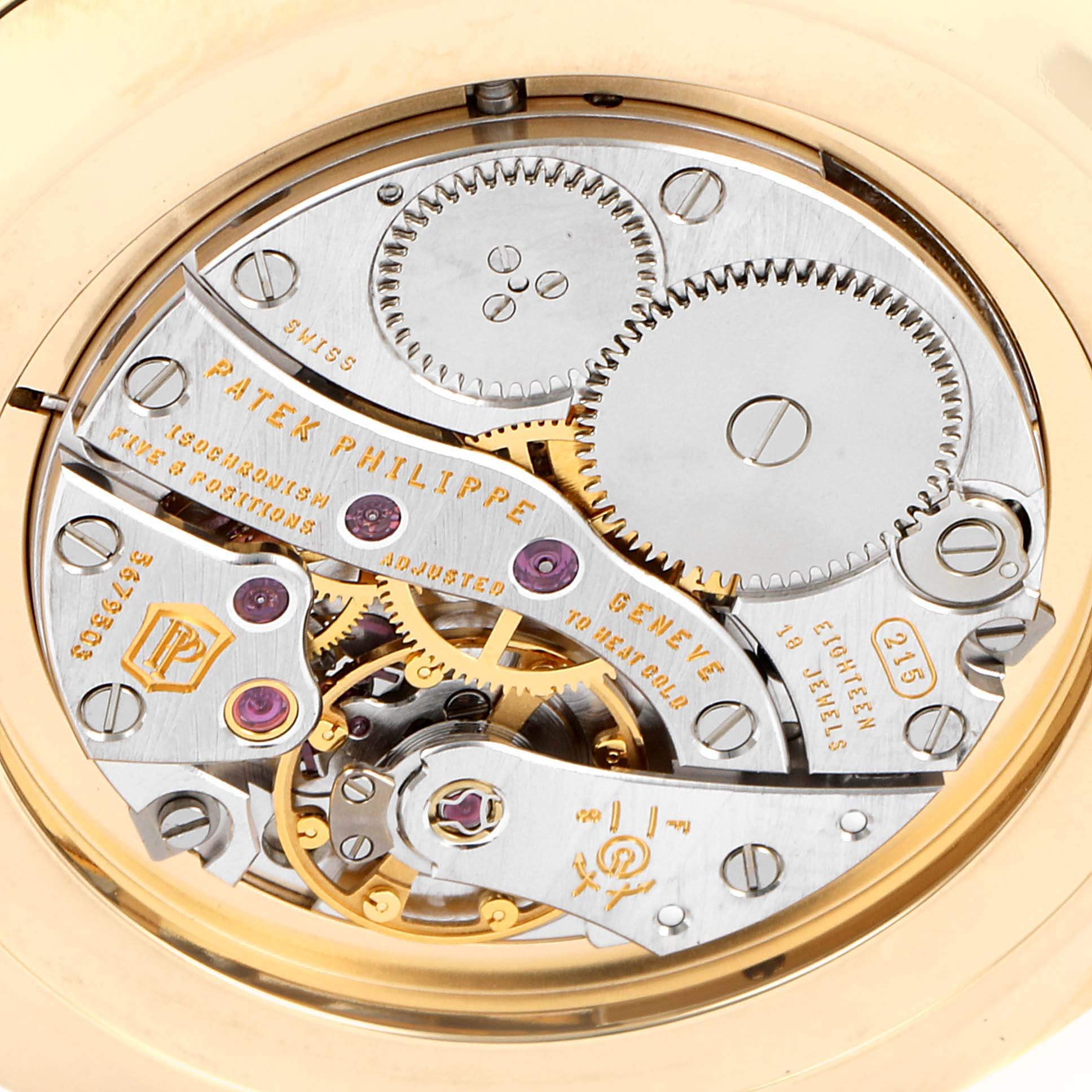 This image shows the intricate movement of the Patek Philippe Calatrava 5119J Men's Yellow Gold White Dial 5119J Men's Yellow Gold White Dial watch from a close-up rear angle.