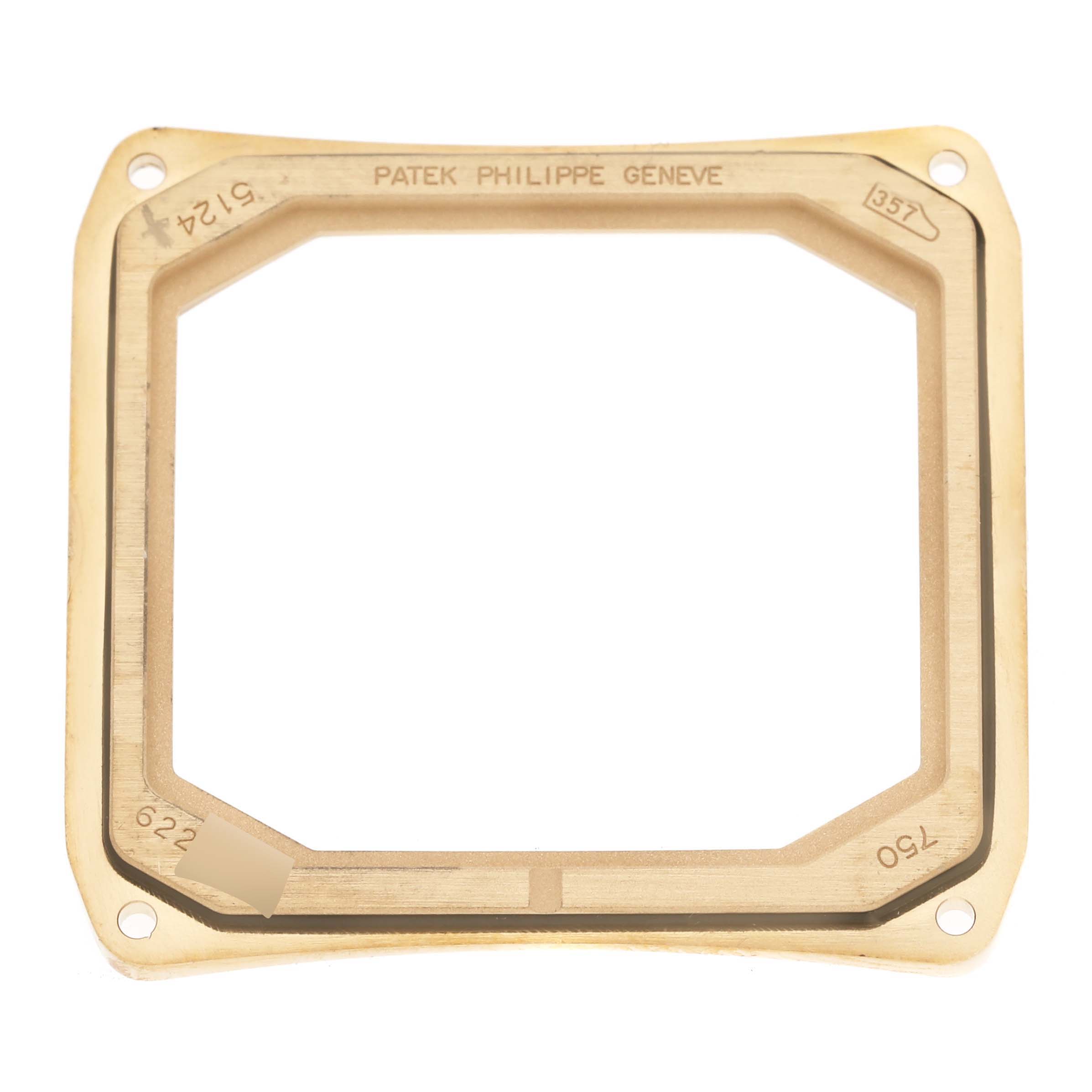 This image shows the gold bezel for a Patek Philippe Gondolo 5124J Men's Yellow Gold Silver Dial 5124J Men's Yellow Gold Silver Dial watch, viewed from above.