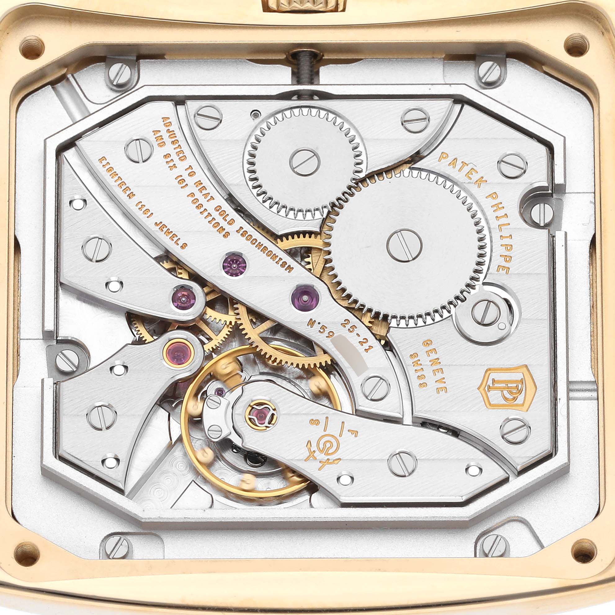 This image shows the back view of the Patek Philippe Gondolo 5124J Men's Yellow Gold Silver Dial 5124J Men's Yellow Gold Silver Dial watch, focusing on its intricate mechanical movement and gears.