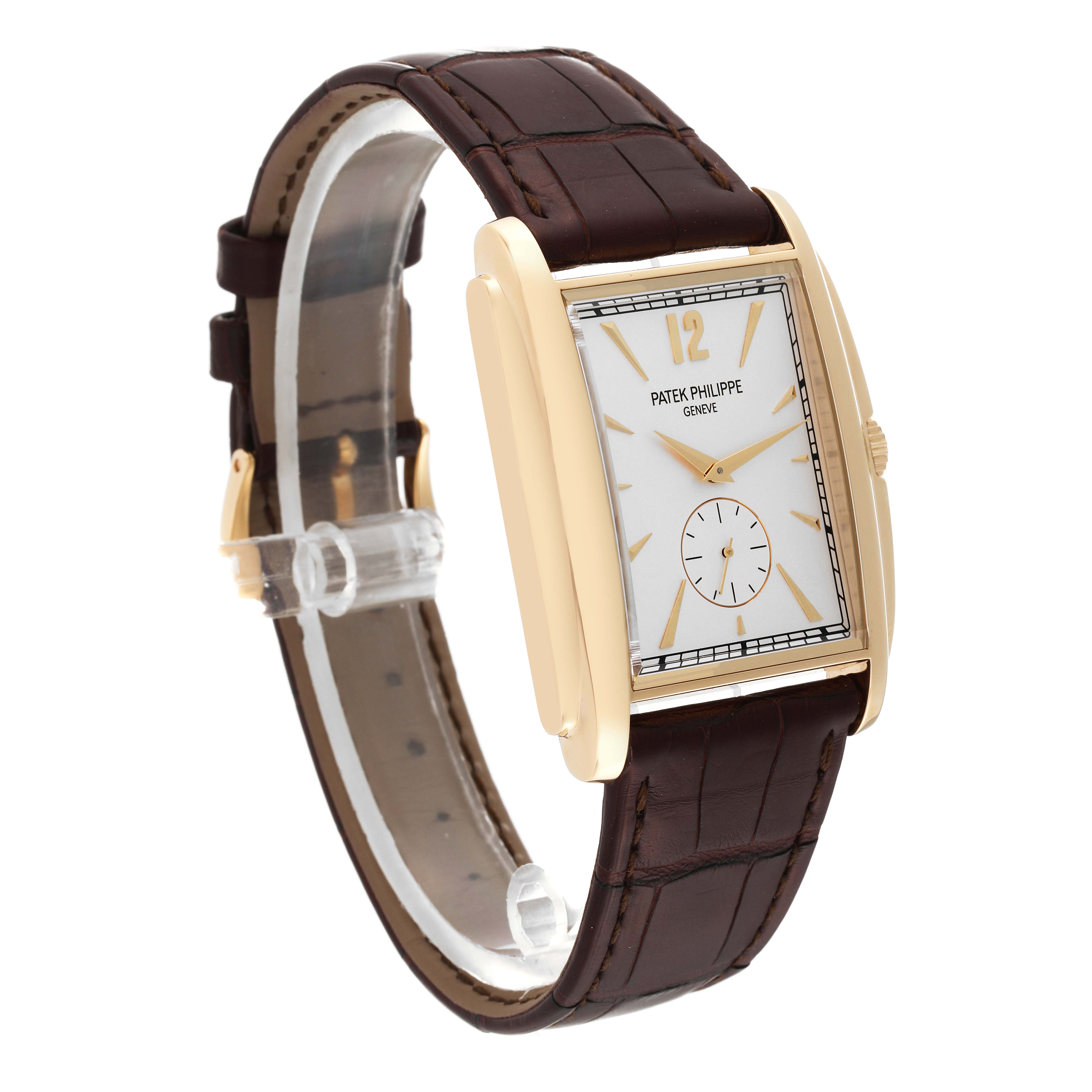 The image shows a Patek Philippe Gondolo 5124J Men's Yellow Gold Silver Dial 5124J Men's Yellow Gold Silver Dial watch from an angled side and front view, featuring its brown leather strap and rectangular dial.
