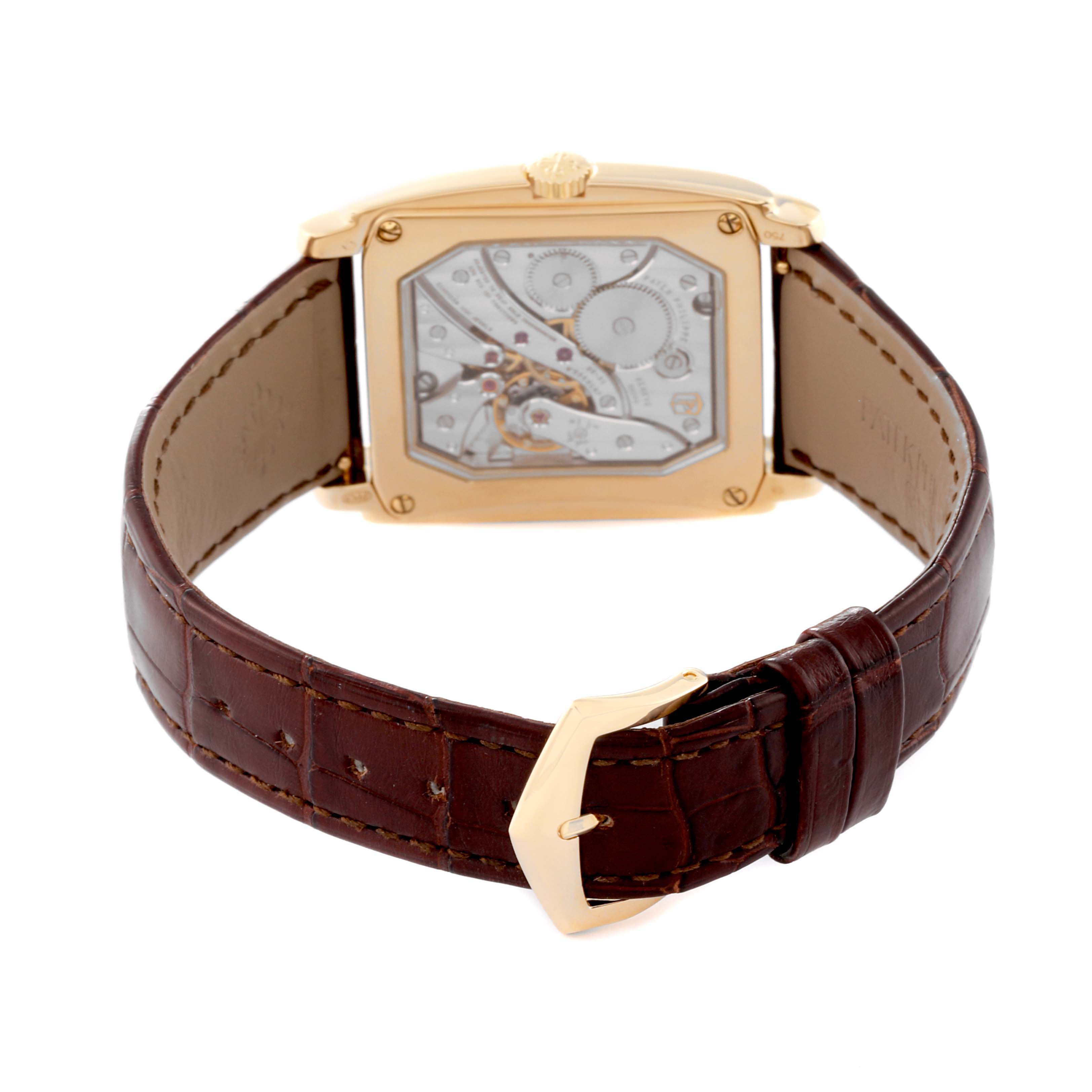 This image shows the Patek Philippe Gondolo 5124J Men's Yellow Gold Silver Dial 5124J Men's Yellow Gold Silver Dial watch from the rear, displaying its movement and brown leather strap with a gold buckle.