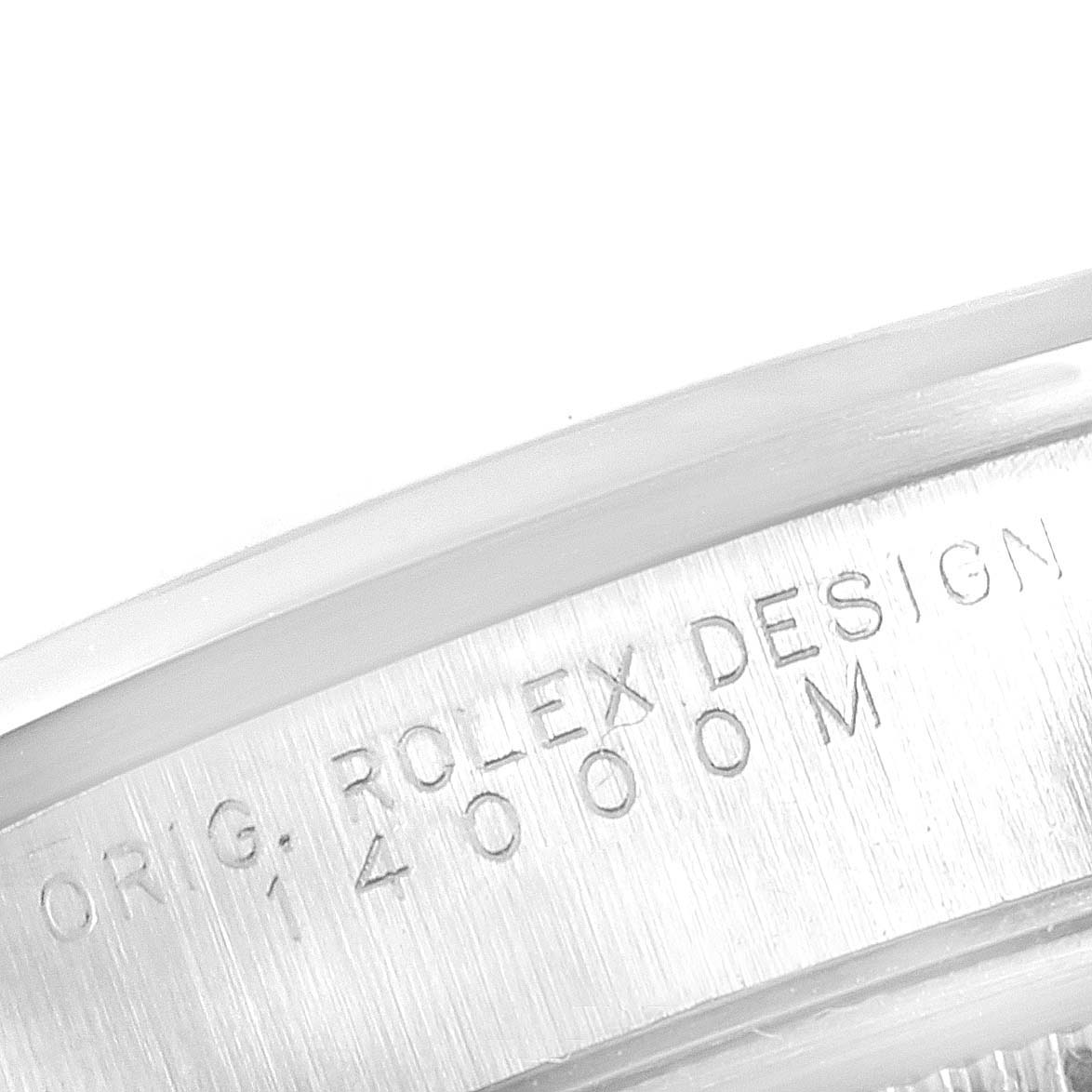 This close-up image shows the engraving on the side of the bezel of a Rolex Air-King 14000M Men's Stainless Steel Blue Dial 14000M Men's Stainless Steel Blue Dial watch.