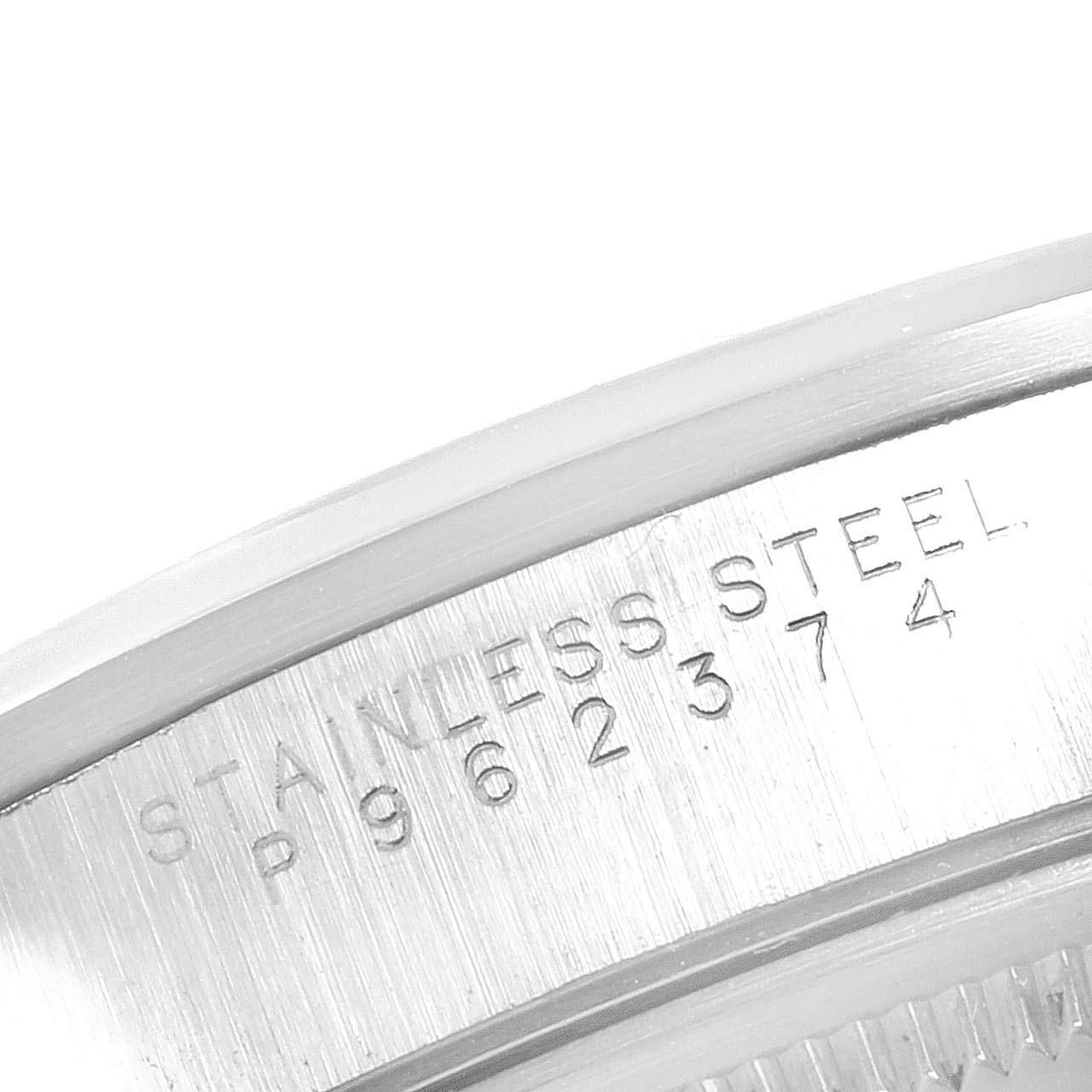 The image shows a close-up of the serial number and "STAINLESS STEEL" engraving on the side of a Rolex Air-King 14000M Men's Stainless Steel Blue Dial 14000M Men's Stainless Steel Blue Dial watch case.
