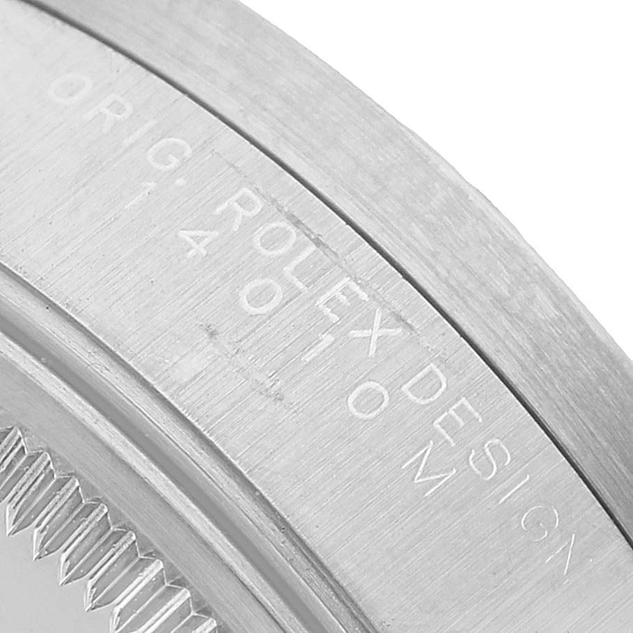 The image shows a close-up of the case side, displaying the "Rolex Design" engraving of the Rolex Air-King 14010 Men's Stainless Steel White Dial.