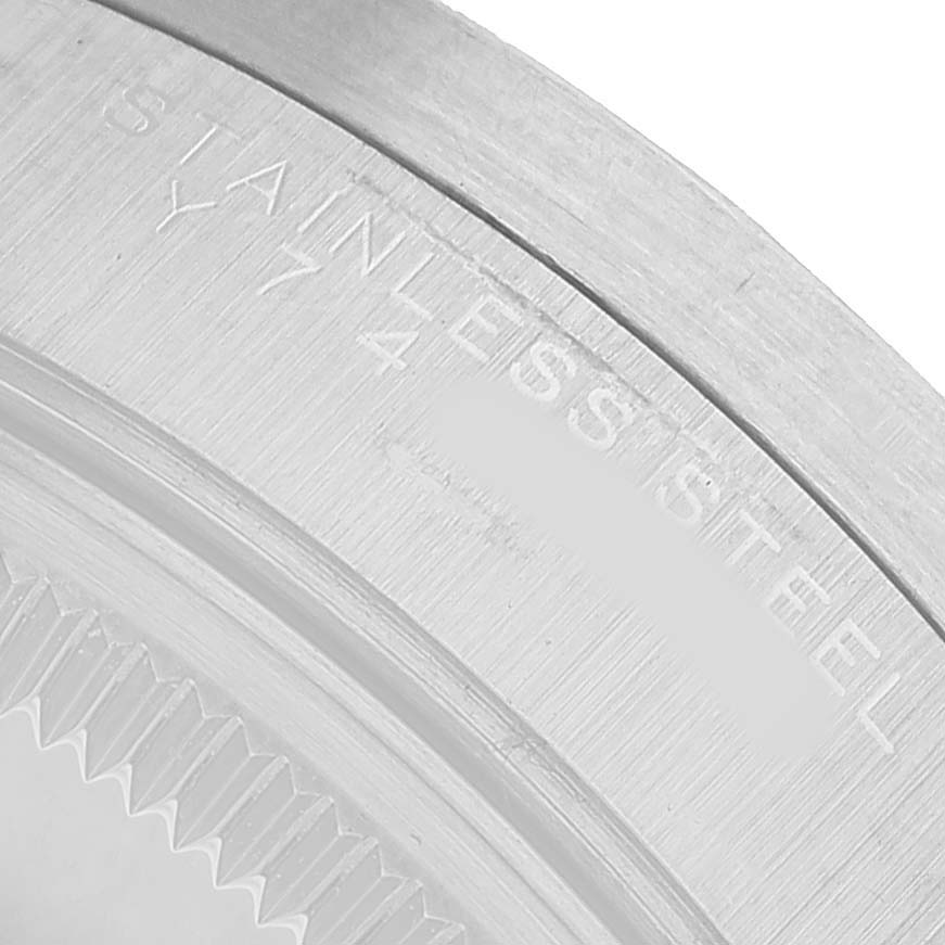 The image shows a close-up of the case back edge of the Rolex Air-King 14010 Men's Stainless Steel White Dial, highlighting "STAINLESS STEEL."
