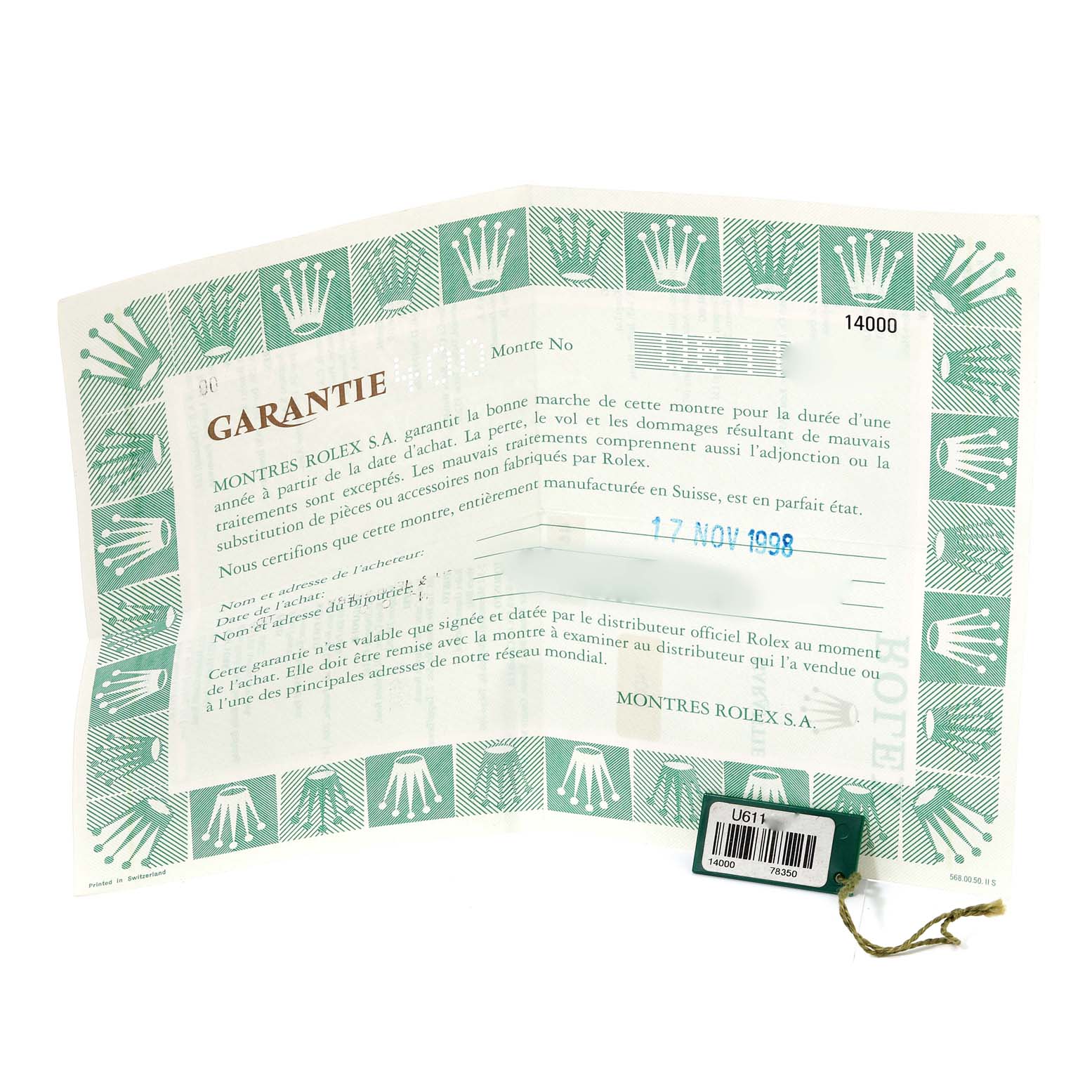 This is a warranty certificate for the Rolex Air-King 14000 Men's Stainless Steel Silver Dial 14000 Men's Stainless Steel Silver Dial watch, showing the document with the brand's logo pattern and a tag.