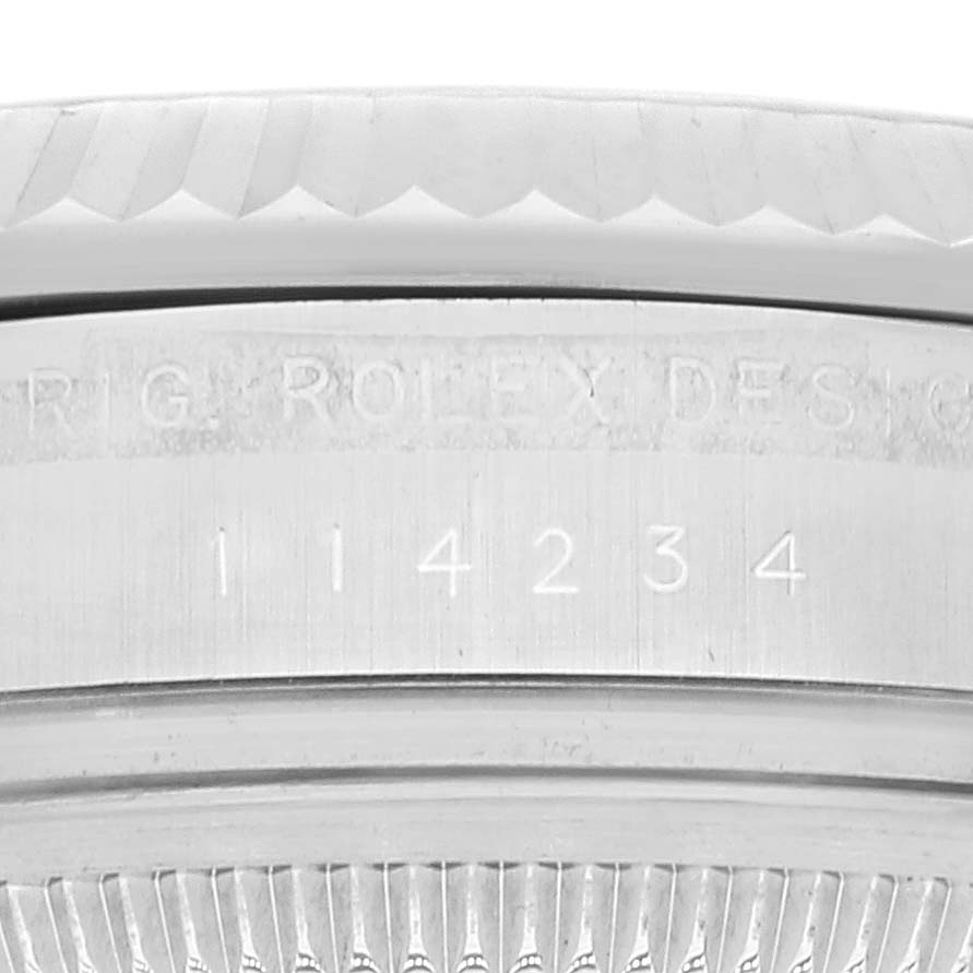 This image shows the case side edge with the model number and "ROLEX DESIGN" engraved on a Rolex Air-King 114234 Men's Stainless Steel Blue Dial 114234 Men's Stainless Steel Blue Dial watch.