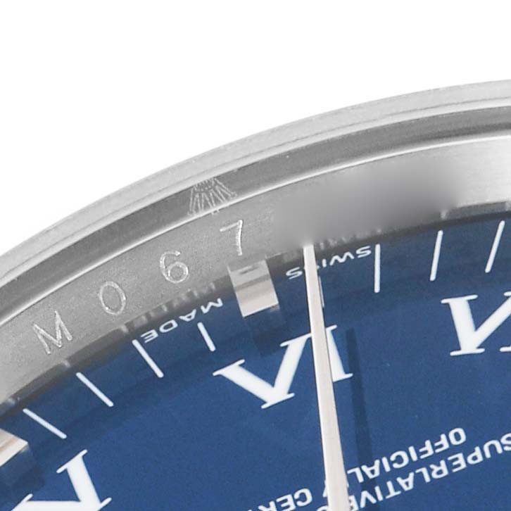 The image shows a close-up of the dial and bezel with engravings of the Rolex Air-King 114234 Men's Stainless Steel Blue Dial 114234 Men's Stainless Steel Blue Dial model.