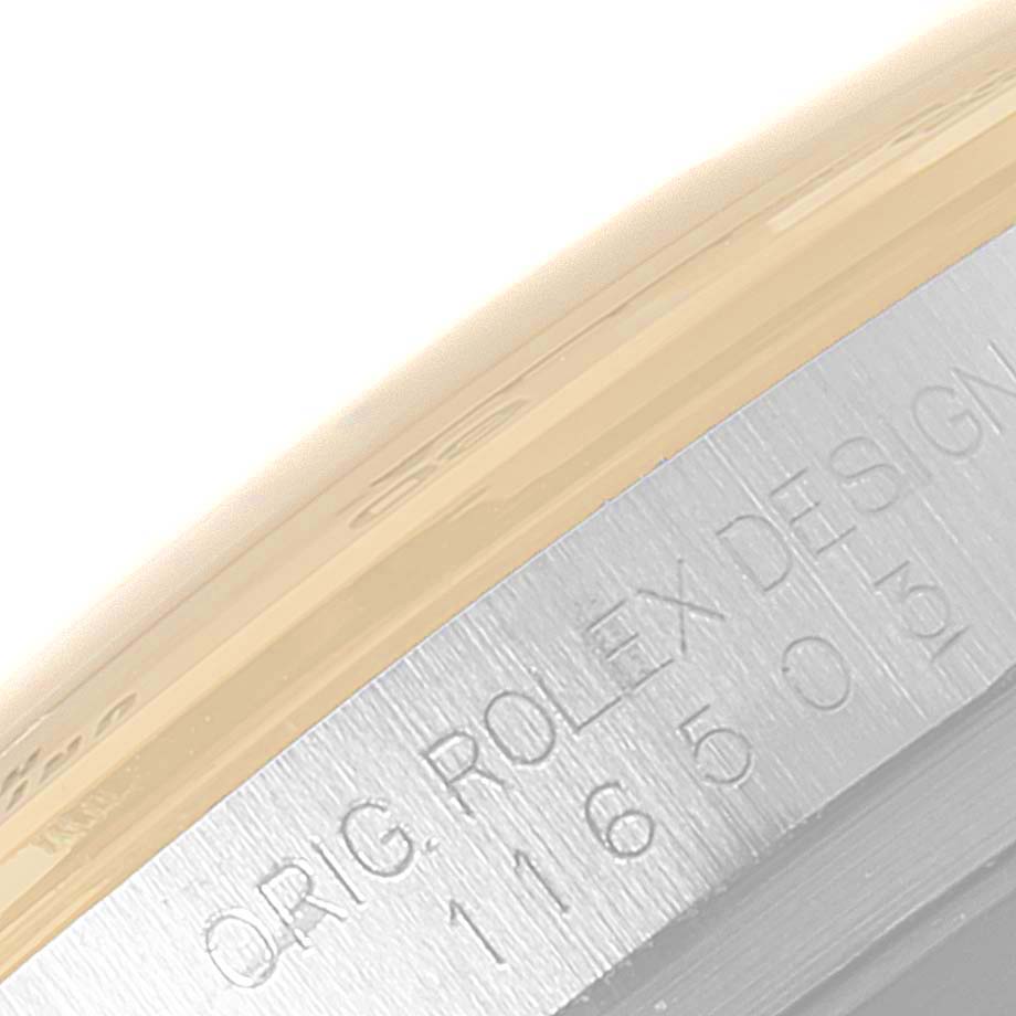 This image shows a close-up view of the engraved case side for a Rolex Daytona 116503 Men's Steel and Gold (two tone) White Dial 116503 Men's Steel and Gold (two tone) White Dial watch.