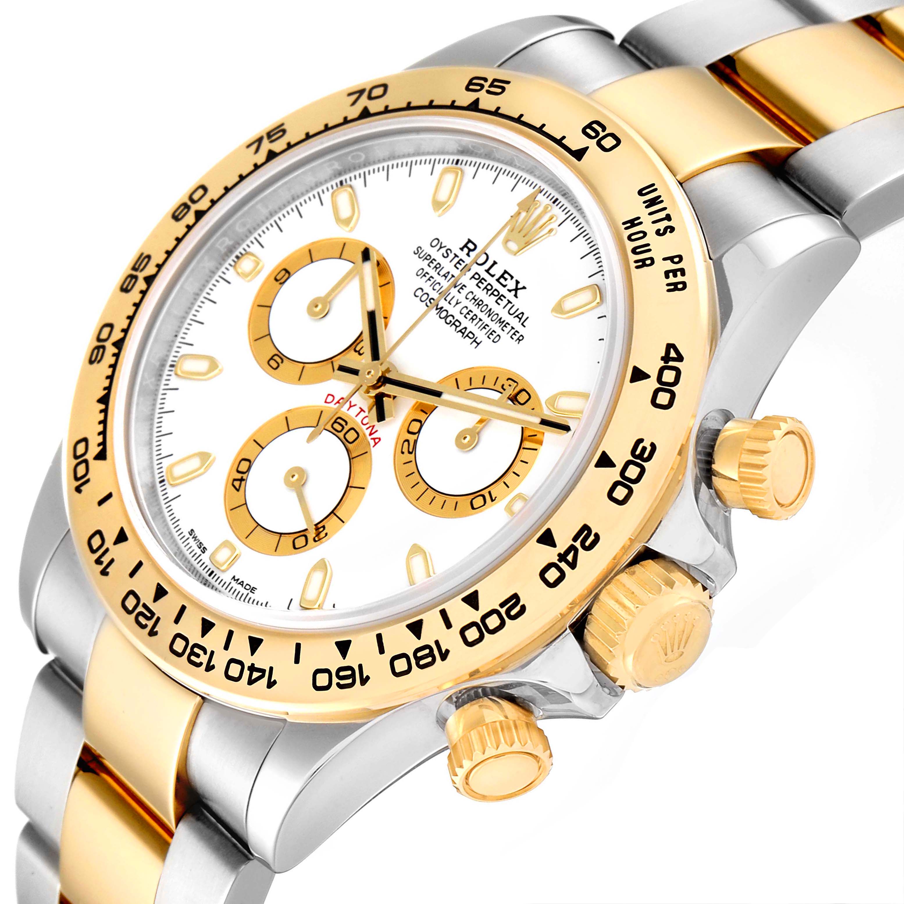 This image shows a close-up angle of the Rolex Daytona 116503 Men's Steel and Gold (two tone) White Dial 116503 Men's Steel and Gold (two tone) White Dial watch, highlighting its bezel, dial, crown, and sub-dials.