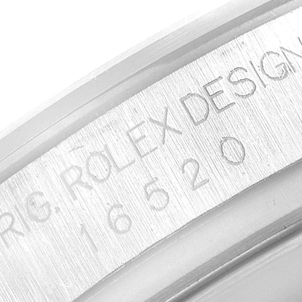 This close-up image shows the engraved model number "16520" and "Rolex Design" text on the inner bezel of a Rolex Daytona 16520 Men's Stainless Steel White Dial 16520 Men's Stainless Steel White Dial watch.