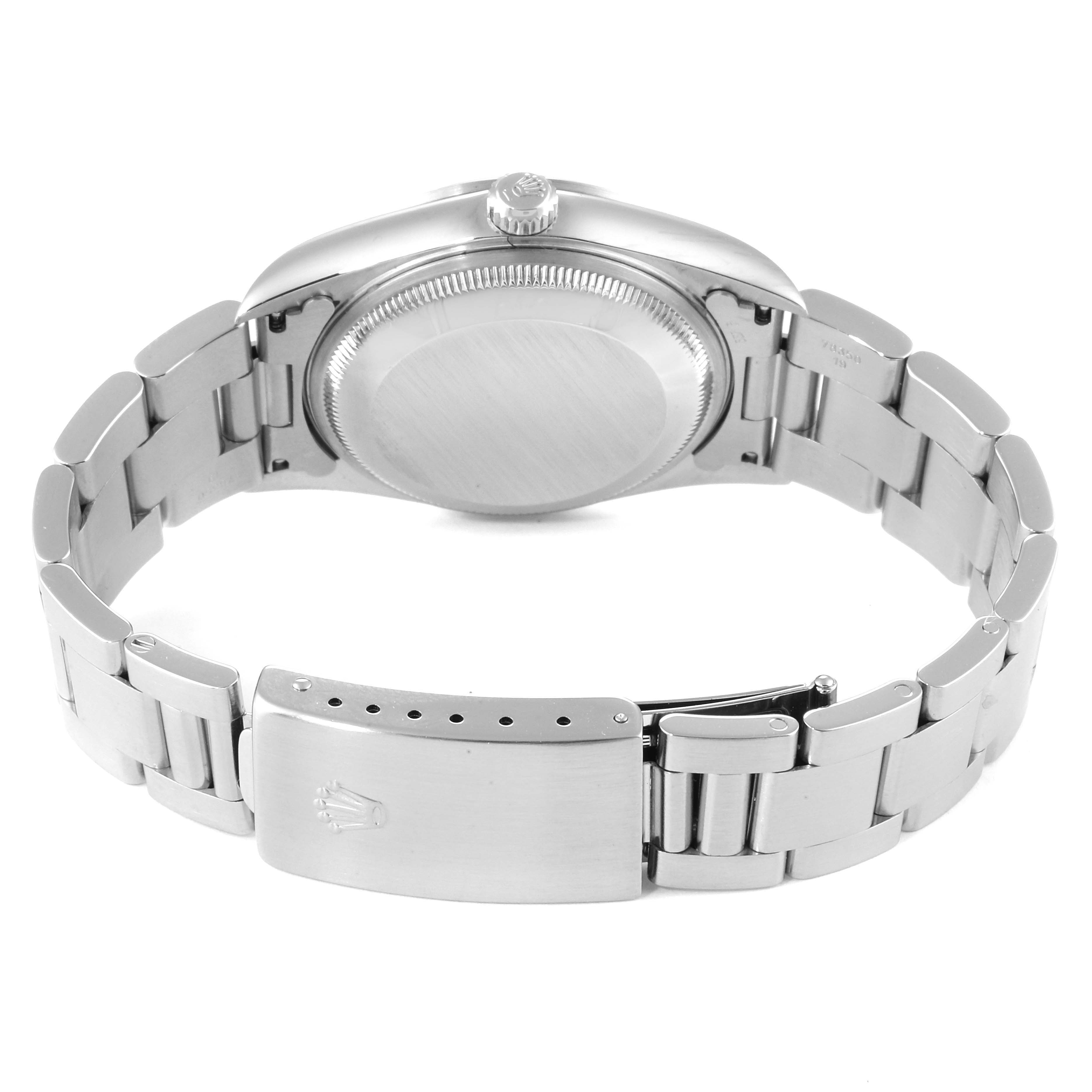 The image shows the back view of a Rolex Date 15200 Men's Stainless Steel Black Dial 15200 Men's Stainless Steel Black Dial model watch, highlighting the case back and metal bracelet with the clasp open.