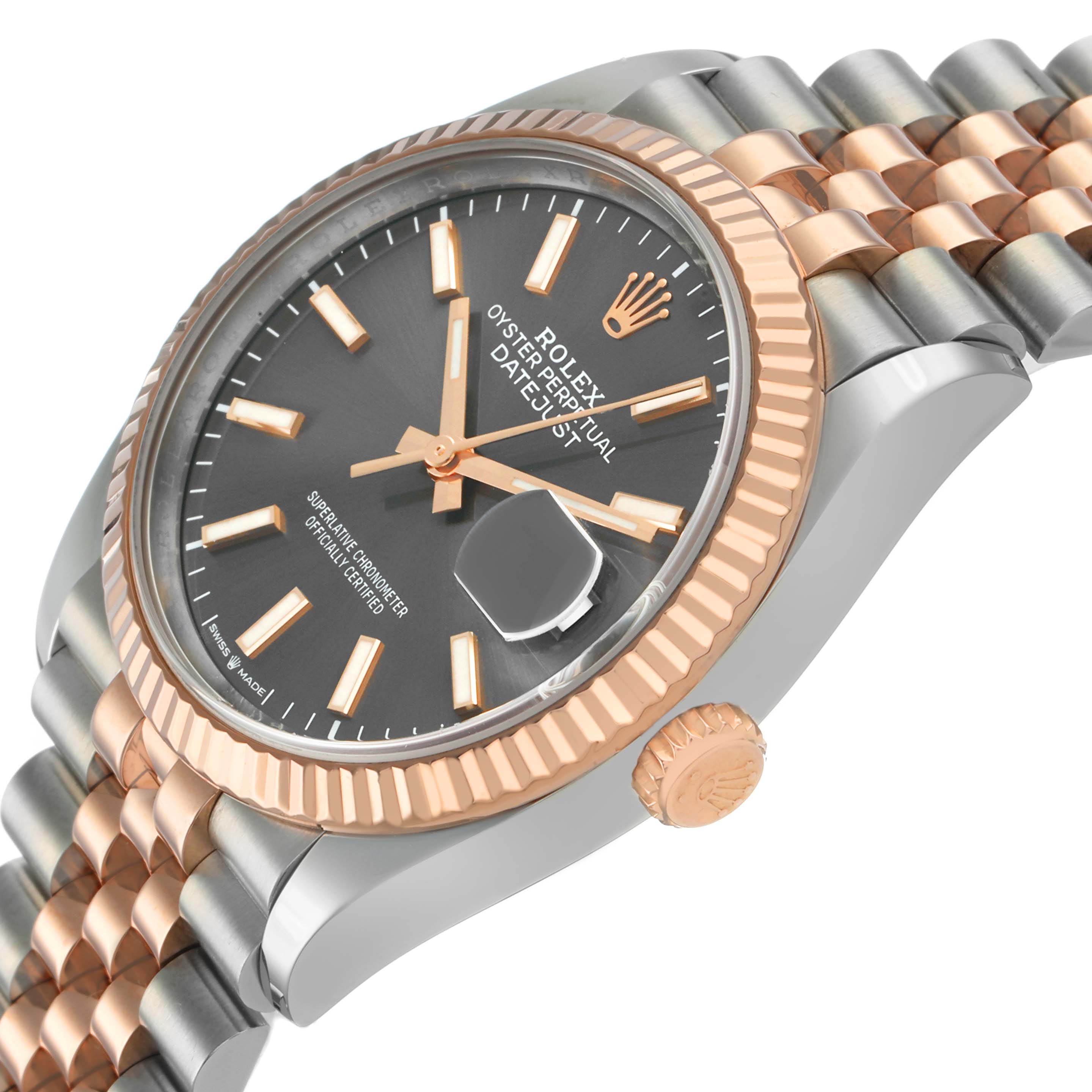 The image shows a Rolex Datejust 126231 Men's Steel and Gold (two tone) Grey Dial watch at a three-quarter angle, highlighting the dial, jubilee bracelet, fluted bezel, and crown.