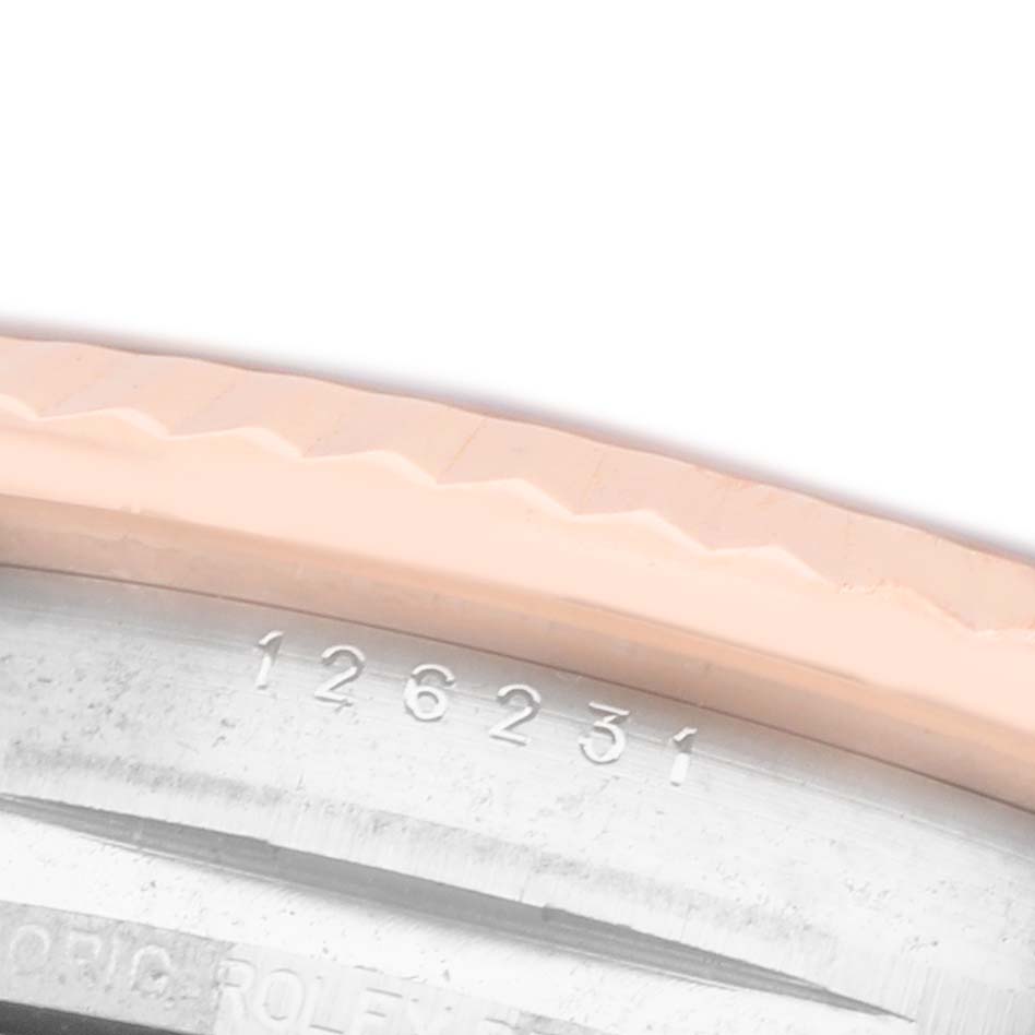 The image shows a close-up of the Rolex Datejust 126231 Men's Steel and Gold (two tone) Grey Dial model's case edge and engraved model number.