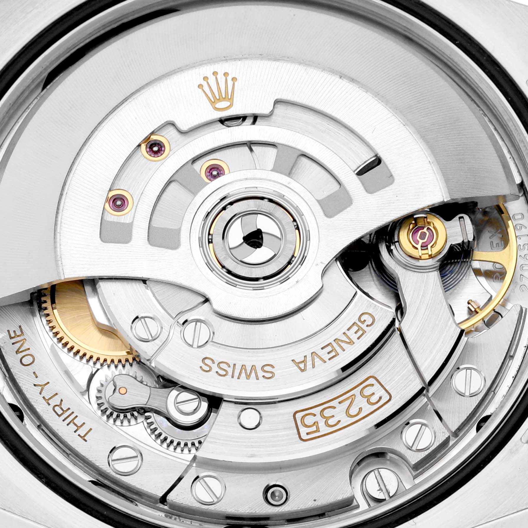 This is a close-up view of the movement mechanism inside a Rolex Datejust 126201 Men's Steel and Gold (two tone) Grey Dial 126201 Men's Steel and Gold (two tone) Grey Dial watch, showcasing intricate gears and components.