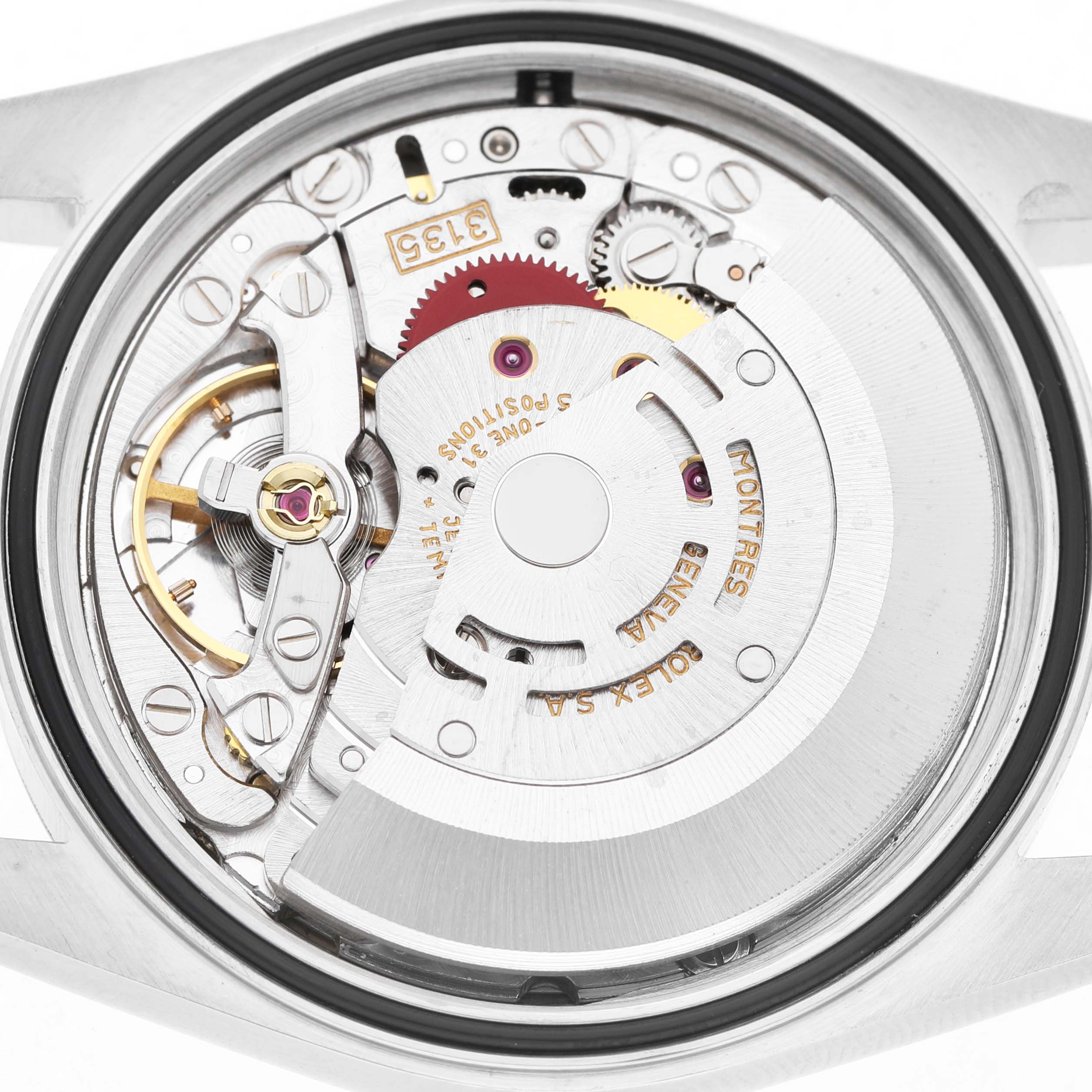 The image shows the movement of a Rolex Datejust 16233 Men's Steel and Gold (two tone) Champagne Dial watch from a top-down angle, highlighting gears and mechanical components.