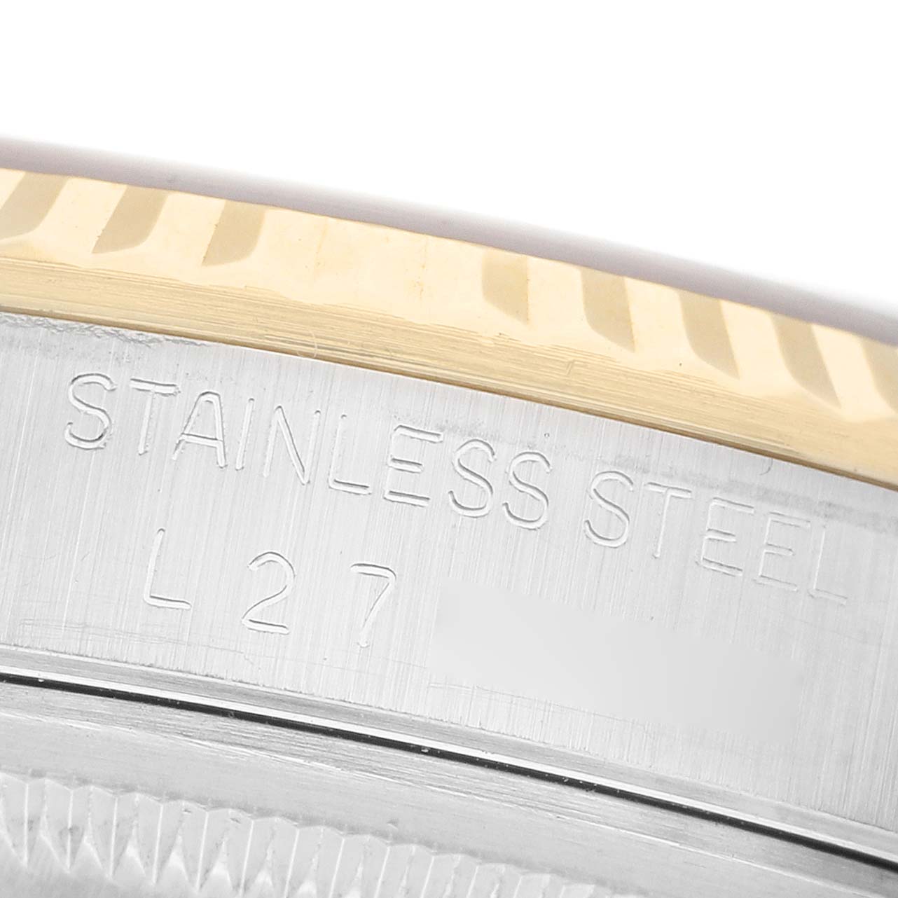 The image shows a close-up of the case side of a Rolex Datejust 16233 Men's Steel and Gold (two tone) Champagne Dial, displaying the engraving and a glimpse of the bezel.