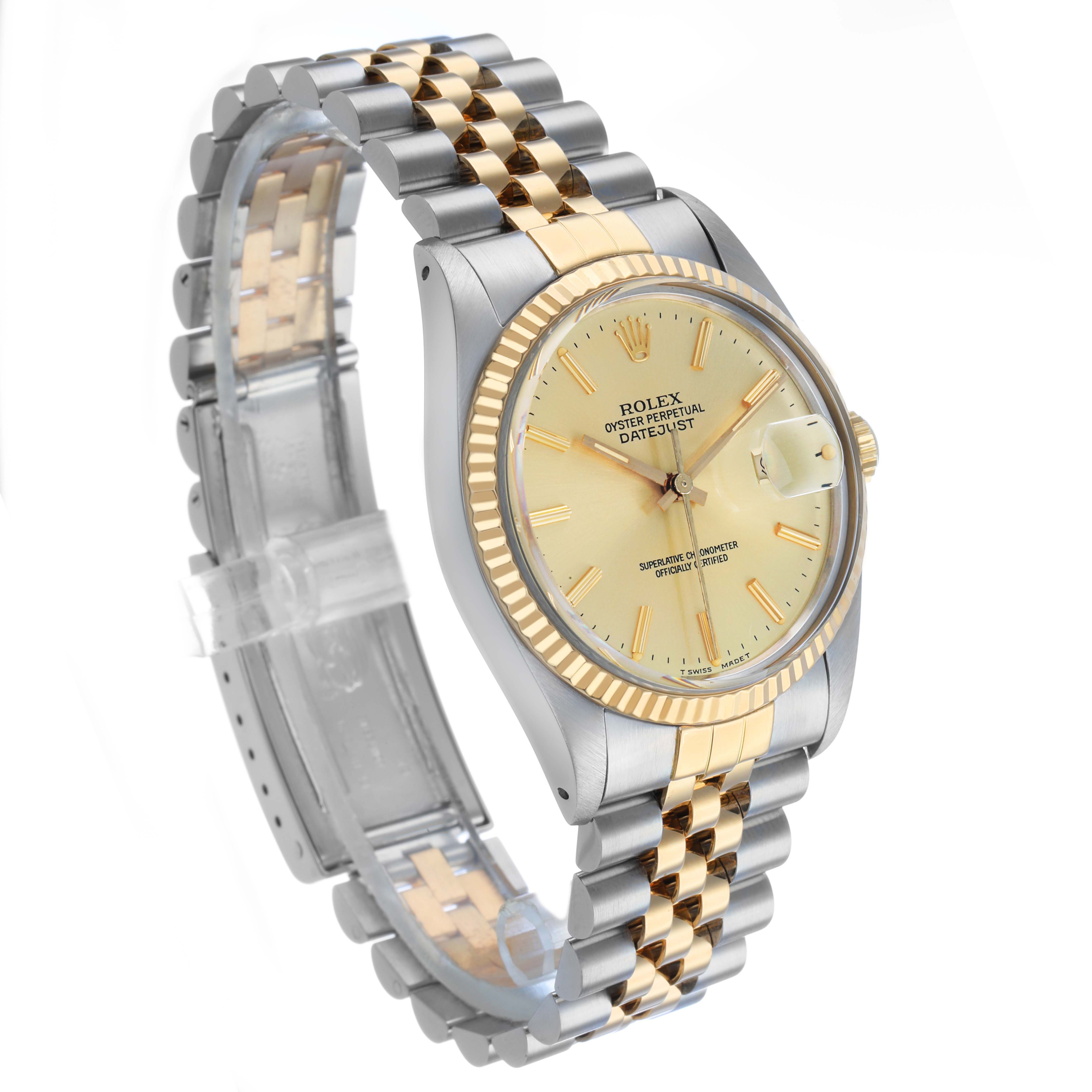 The Rolex Datejust 16013 Men's Steel and Gold (two tone) Champagne Dial watch is shown at an angle displaying the face, bezel, crown, and two-tone bracelet.