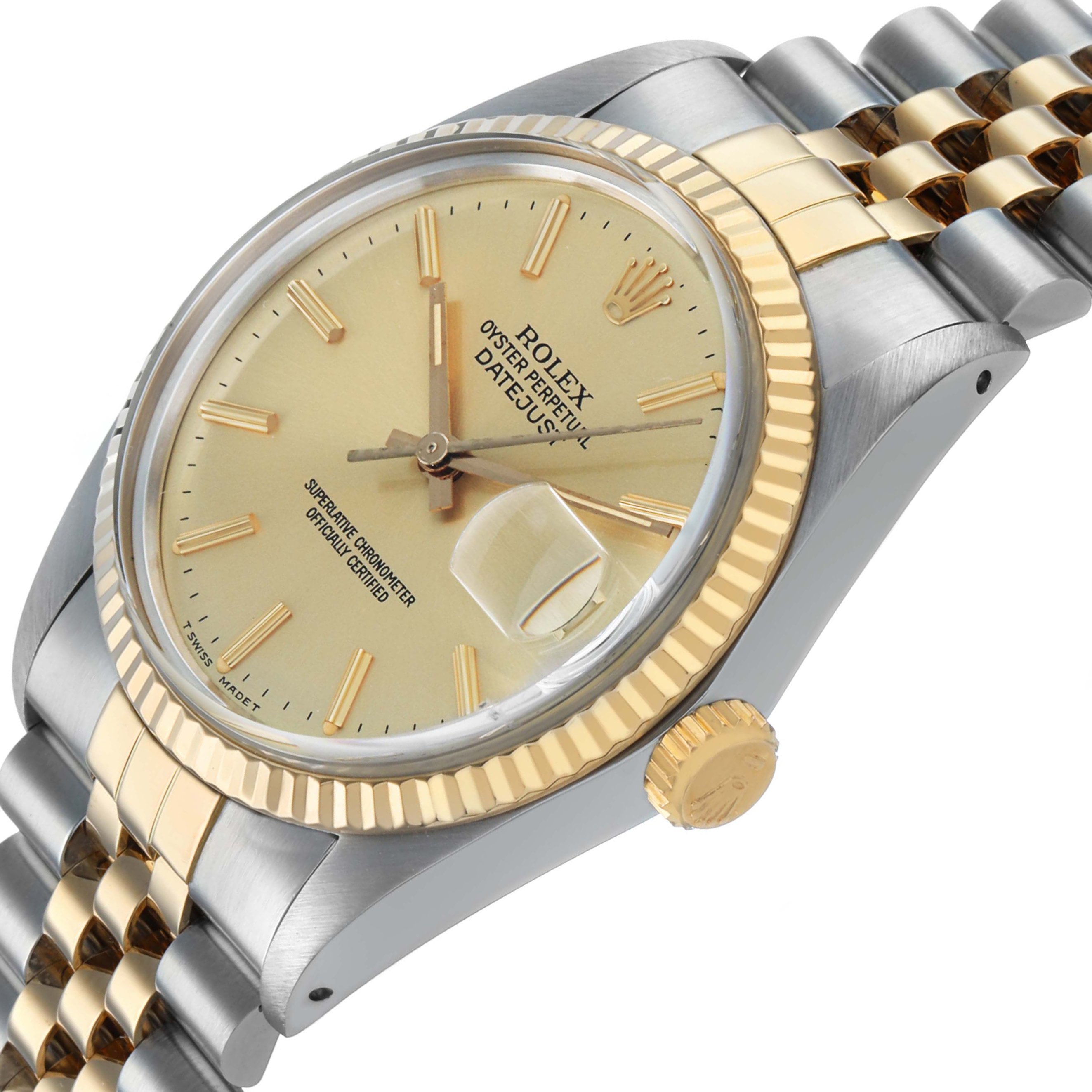 The Rolex Datejust 16013 Men's Steel and Gold (two tone) Champagne Dial watch is shown at an angle highlighting its face, bezel, crown, and part of the bracelet.