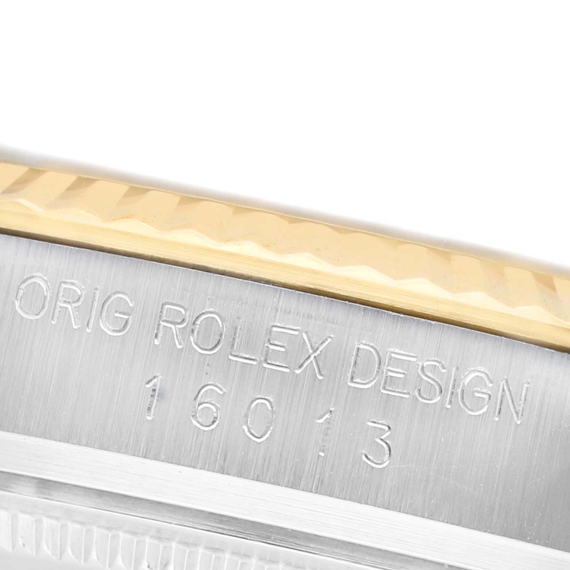 The image shows a close-up of the case side, bezel, and engraved model number of a Rolex Datejust 16013 Men's Steel and Gold (two tone) Champagne Dial watch.