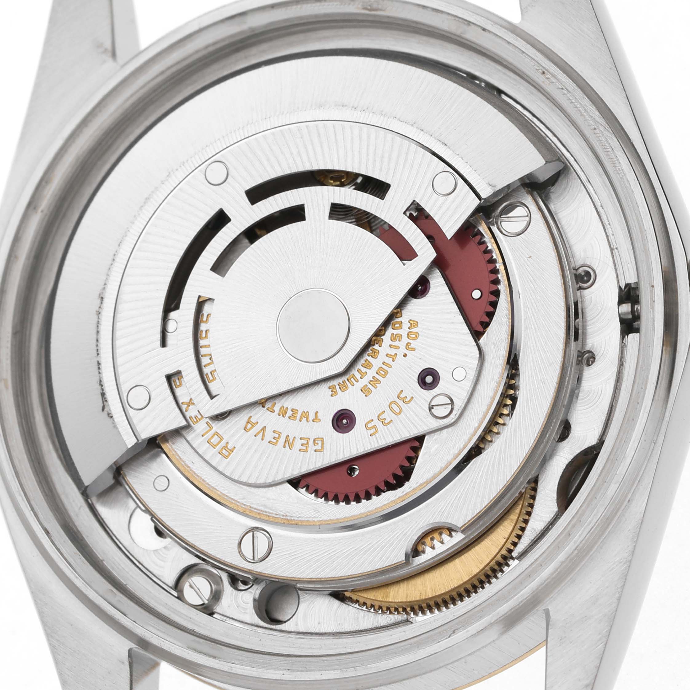 The image shows the movement mechanism of a Rolex Datejust 16013 Men's Steel and Gold (two tone) Champagne Dial watch from a top-down angle, highlighting gears and inscriptions.