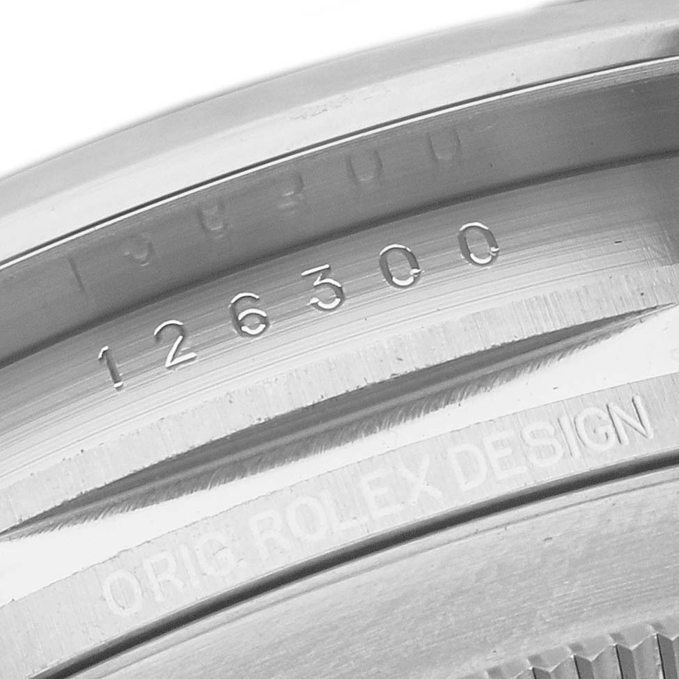 This image shows a close-up of the case back of a Rolex Datejust 41 126300 Men
s Stainless Steel Blue Dial 126300 Men
s Stainless Steel Blue Dial, highlighting the model number "126300" and "ORIG. ROLEX DESIGN".