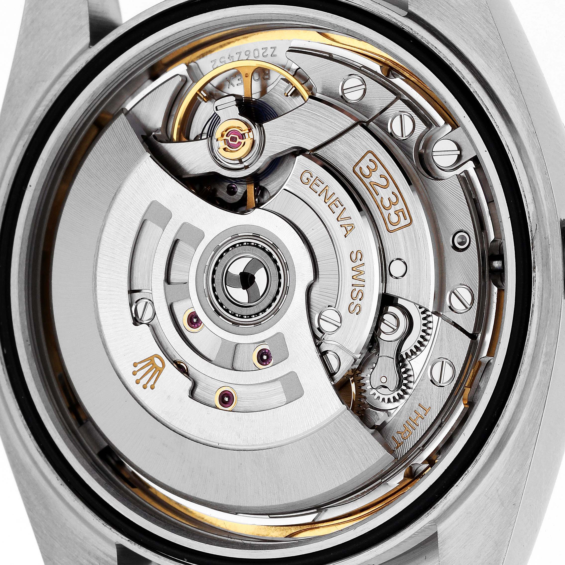 The image shows the intricate internal mechanism of the Rolex Datejust 41 126300 Men
s Stainless Steel Blue Dial 126300 Men
s Stainless Steel Blue Dial watch, highlighting its movement and gears.