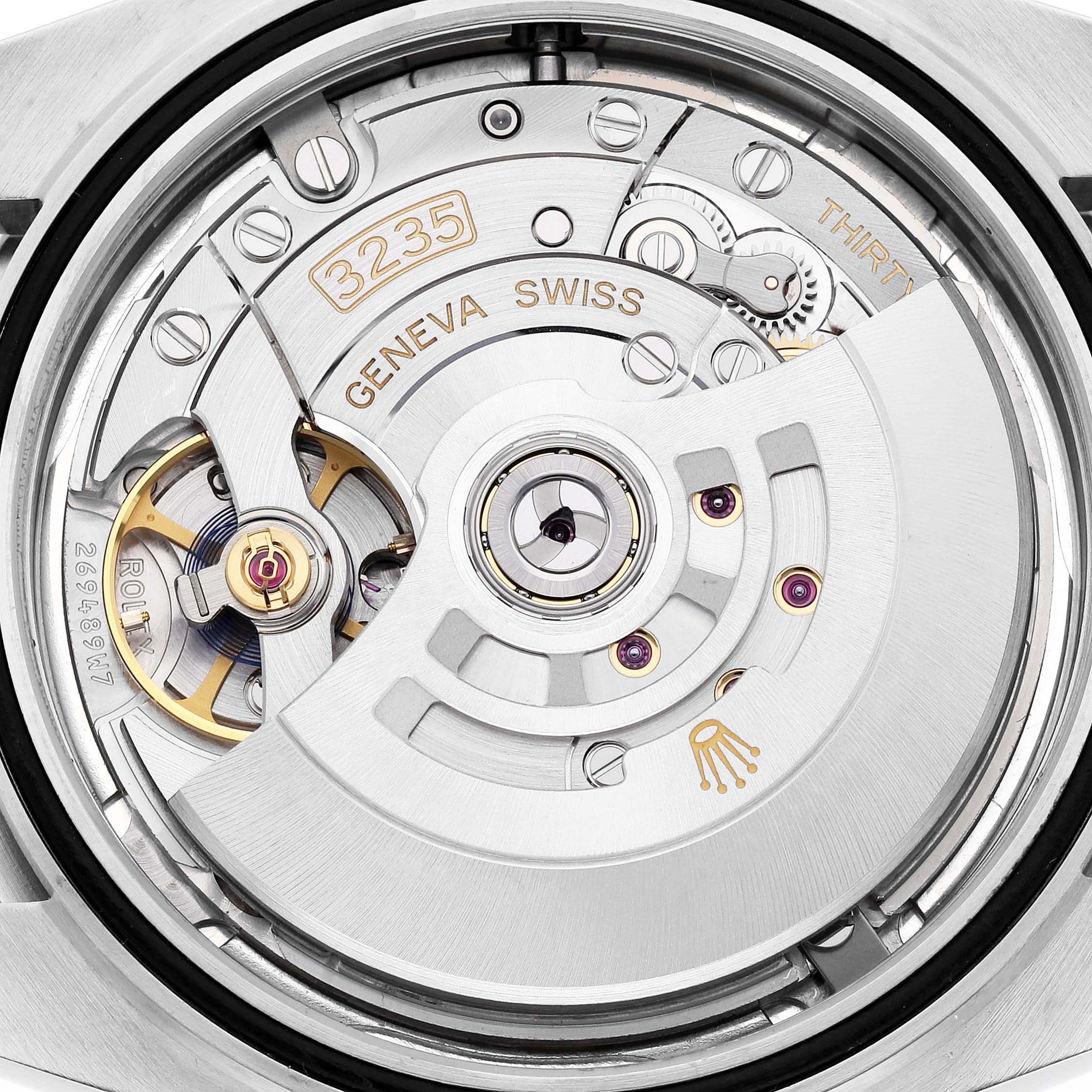 This image shows the movement of a Rolex Datejust 41 126300 Men
s Stainless Steel Blue Dial 126300 Men
s Stainless Steel Blue Dial from a back view, highlighting the intricate mechanism and rotor.