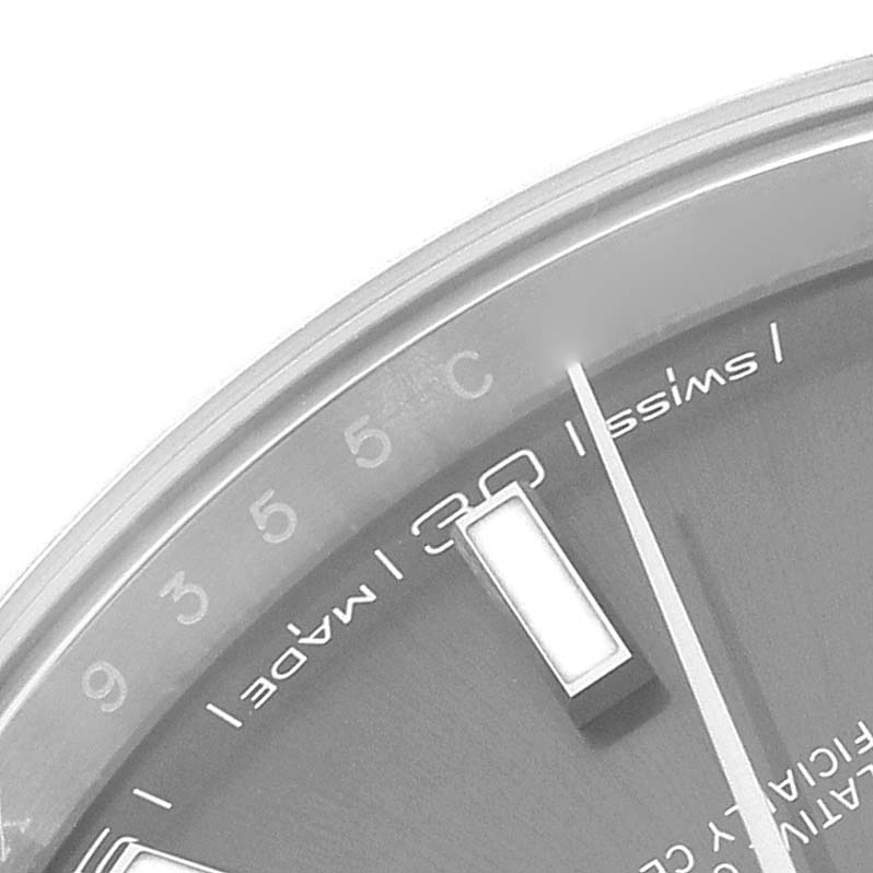 The image shows a close-up of the dial of a Rolex Datejust 41 126300 Men's Stainless Steel Grey Dial 126300 Men's Stainless Steel Grey Dial watch, highlighting the hour markers and partial text on the dial.