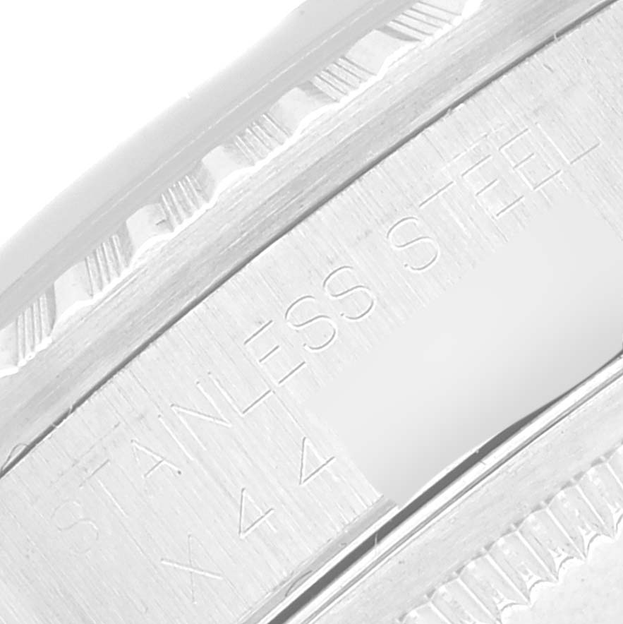 This close-up image shows the "Stainless Steel" engraving on the case back edge of a Rolex Datejust 16220 Men's Stainless Steel Blue Dial 16220 Men's Stainless Steel Blue Dial watch.