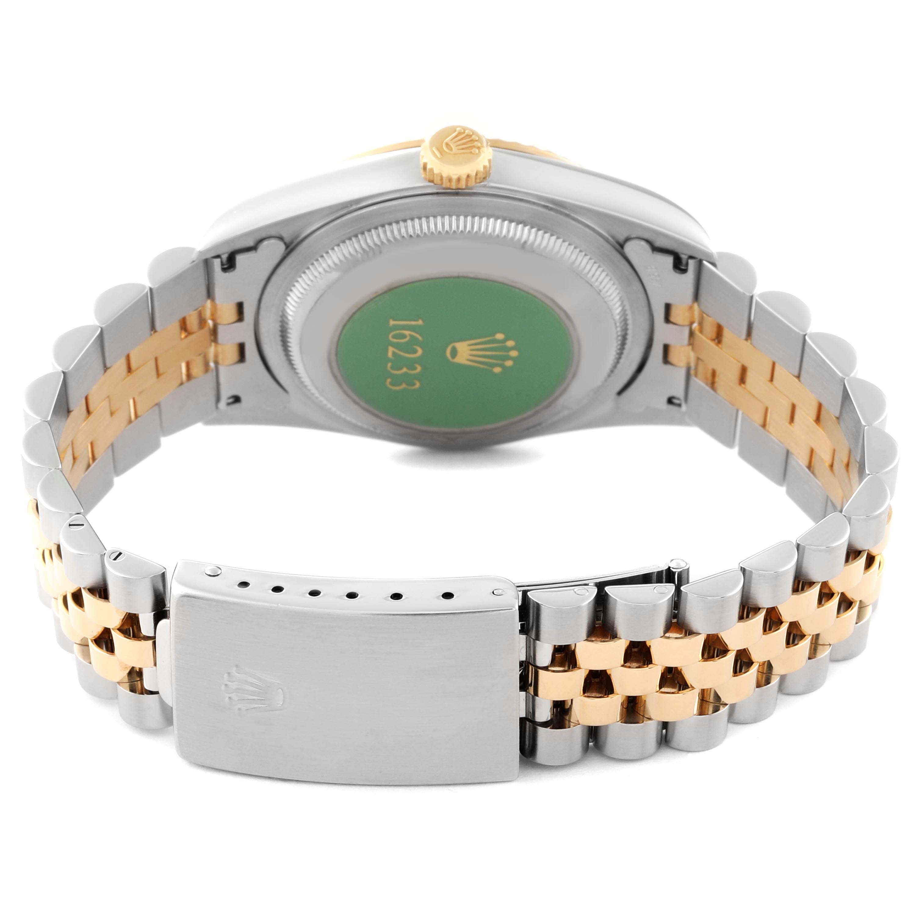 This image shows the back and bracelet of a Rolex Datejust 16233 Men's Steel and Gold (two tone) Champagne Dial 16233 Men's Steel and Gold (two tone) Champagne Dial watch, highlighting its two-tone metal design and clasp.