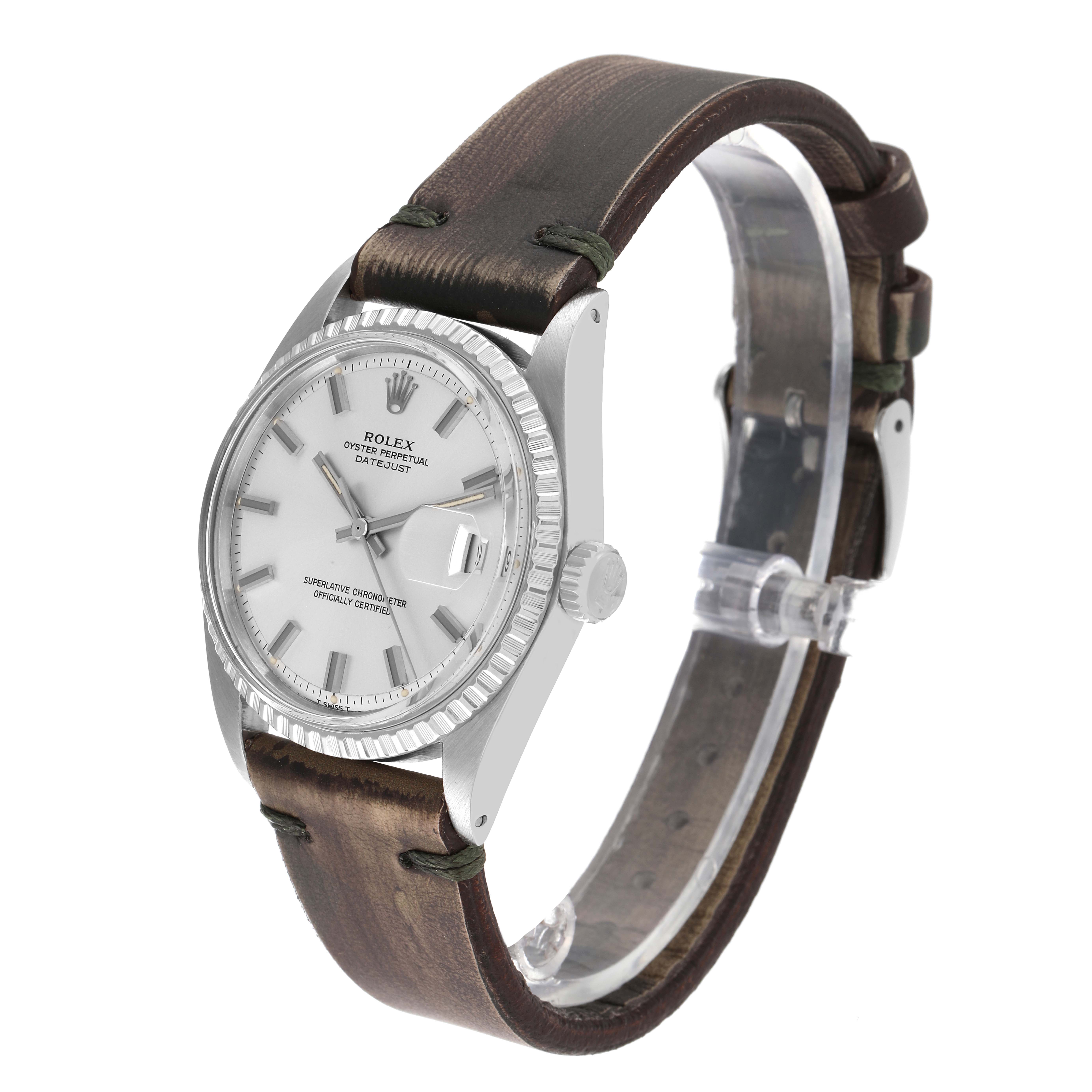 The image shows a side angle of the Rolex Vintage Collection 1603 Men's Stainless Steel Silver Dial 1603 Men's Stainless Steel Silver Dial watch, highlighting its face, crown, and leather strap.