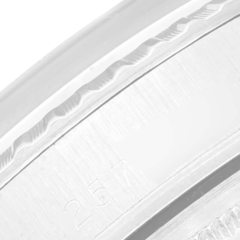 A close-up angle shows part of the bezel and case of the Vintage Collection model watch by Rolex.