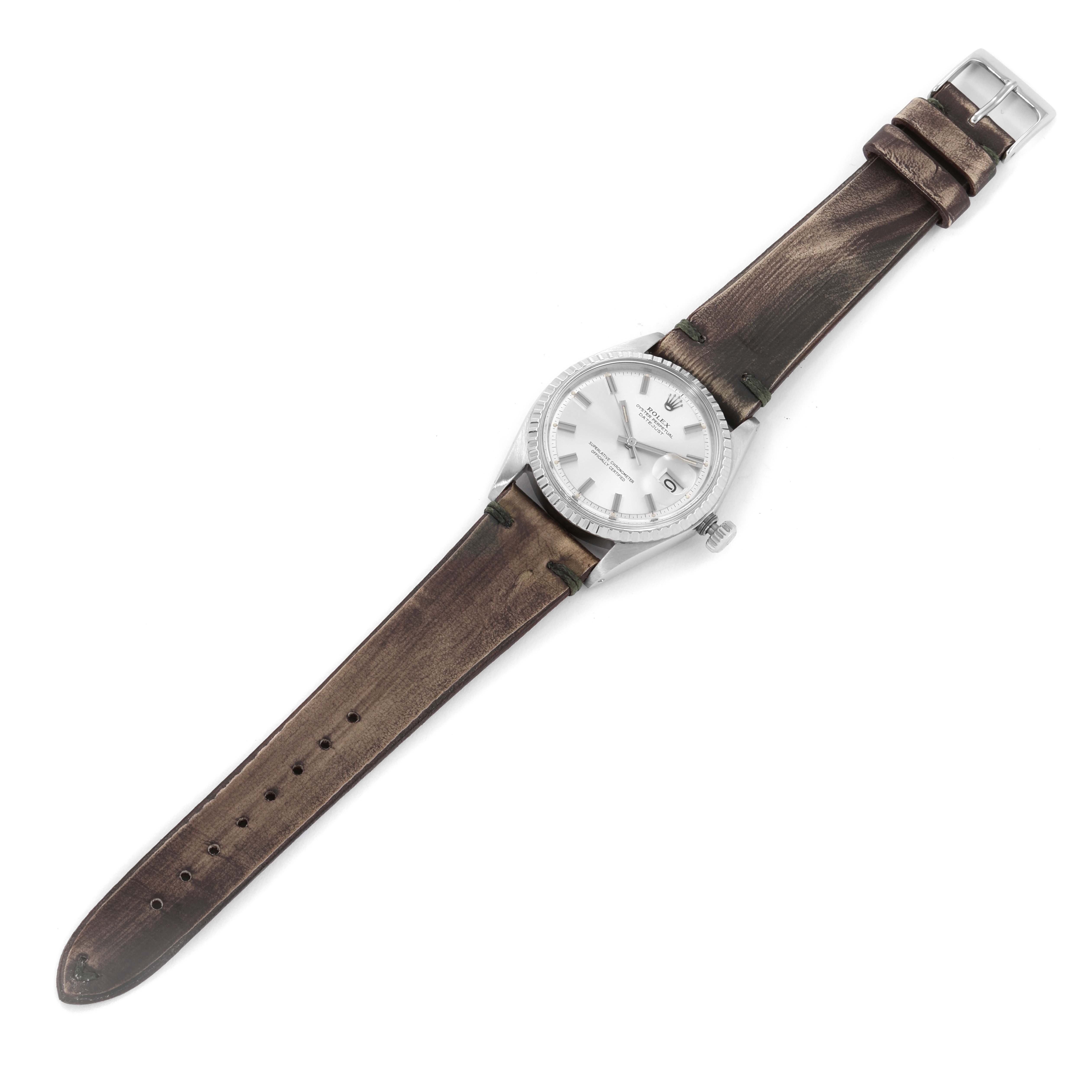 The Vintage Collection model by Rolex is shown from a top view, featuring its face, dial, case, crown, and full leather strap.