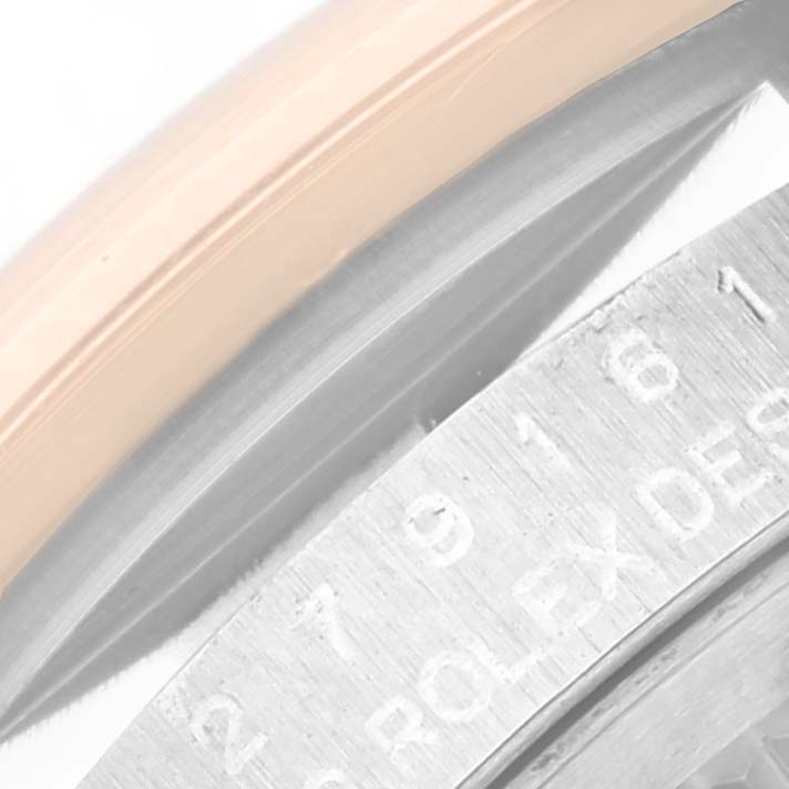 This image shows a close-up of the bezel and part of the case revealing the Rolex engraving on a Datejust model.