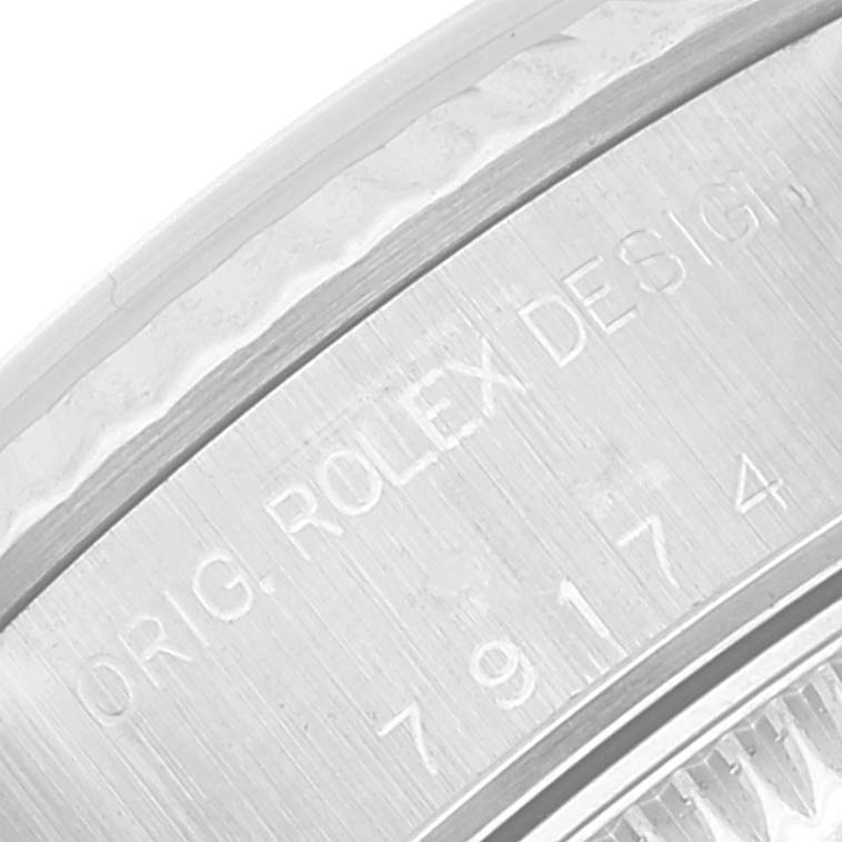This image shows a close-up of the engraved case back and serial number on a Rolex Datejust 79174 Women's Stainless Steel Mother of Pearl Dial 79174 Women's Stainless Steel Mother of Pearl Dial watch.