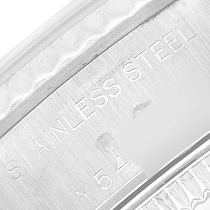 This is a close-up image of the inner bezel of a Rolex Datejust 79174 Women's Stainless Steel Mother of Pearl Dial 79174 Women's Stainless Steel Mother of Pearl Dial watch, showing the text "STAINLESS STEEL" and a partial serial number.