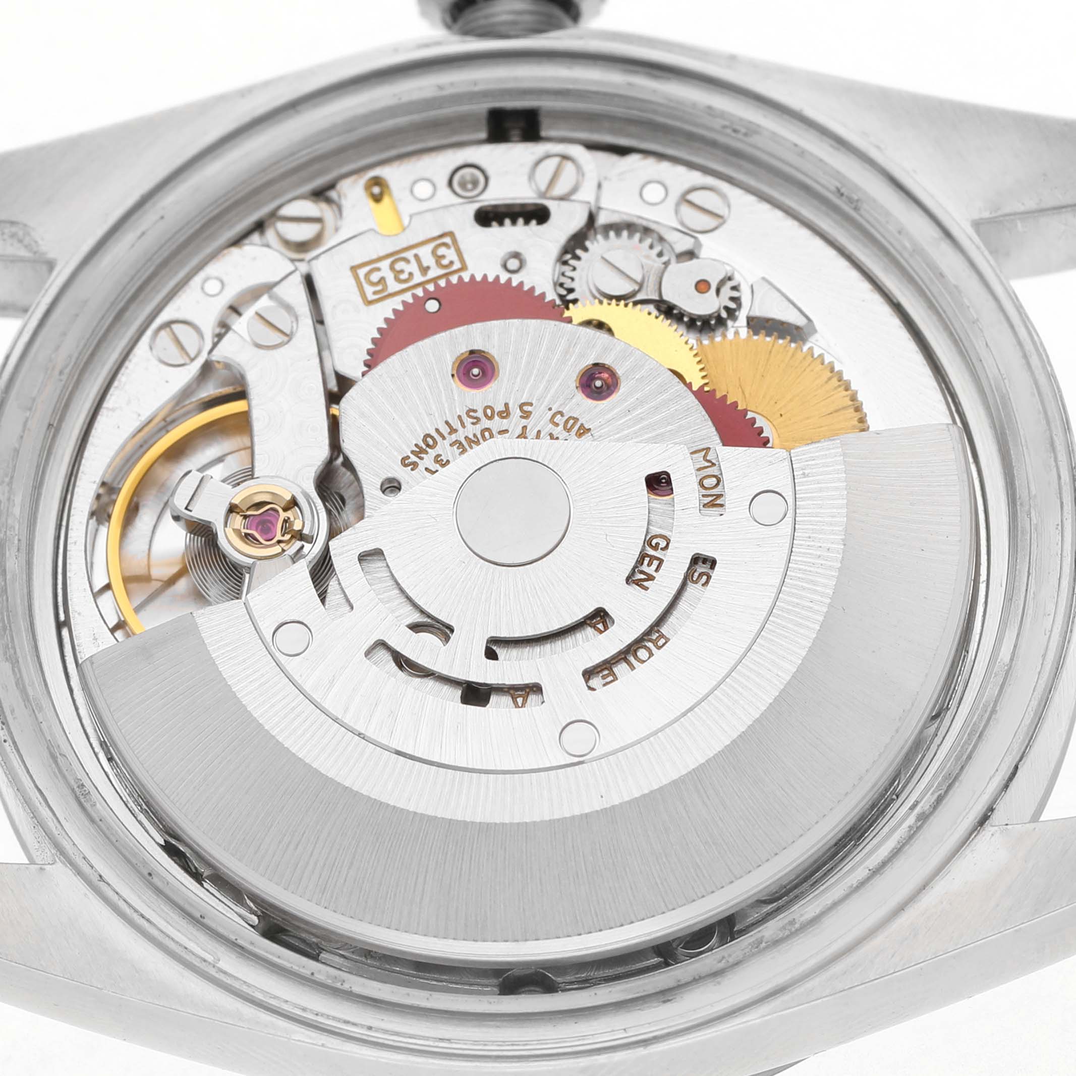 The image shows the movement and inner workings of a Rolex Datejust 16234 Men's Stainless Steel Silver Dial watch from a back view.