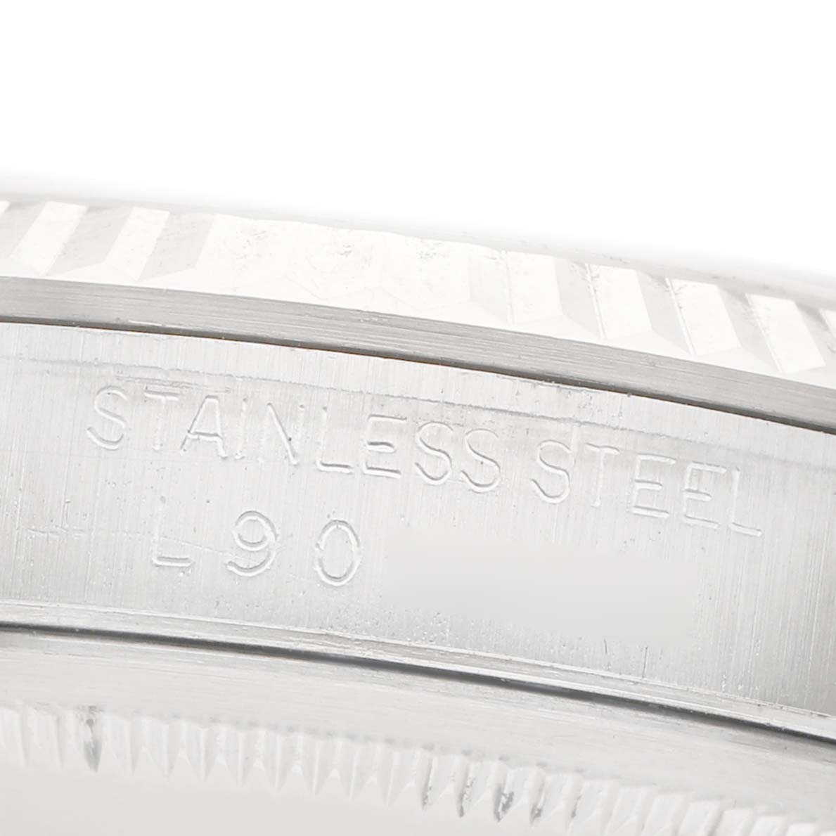 The image shows a close-up of the stainless steel case side with engravings on the Rolex Datejust 16234 Men's Stainless Steel Silver Dial watch.