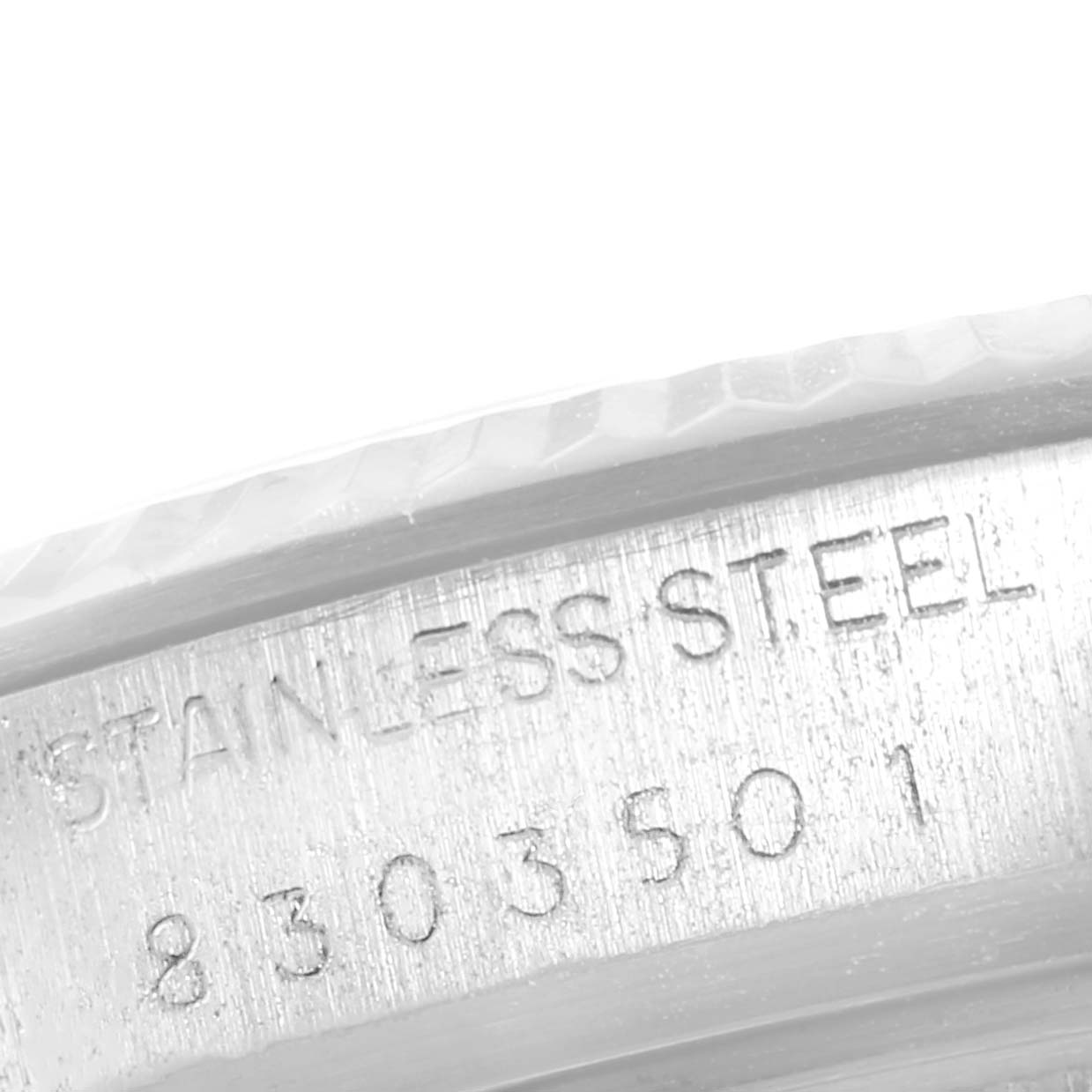 This image shows a close-up of the engraved text on the stainless steel case of a Rolex Datejust 16014 Men
s Stainless Steel Silver Dial 16014 Men
s Stainless Steel Silver Dial watch.