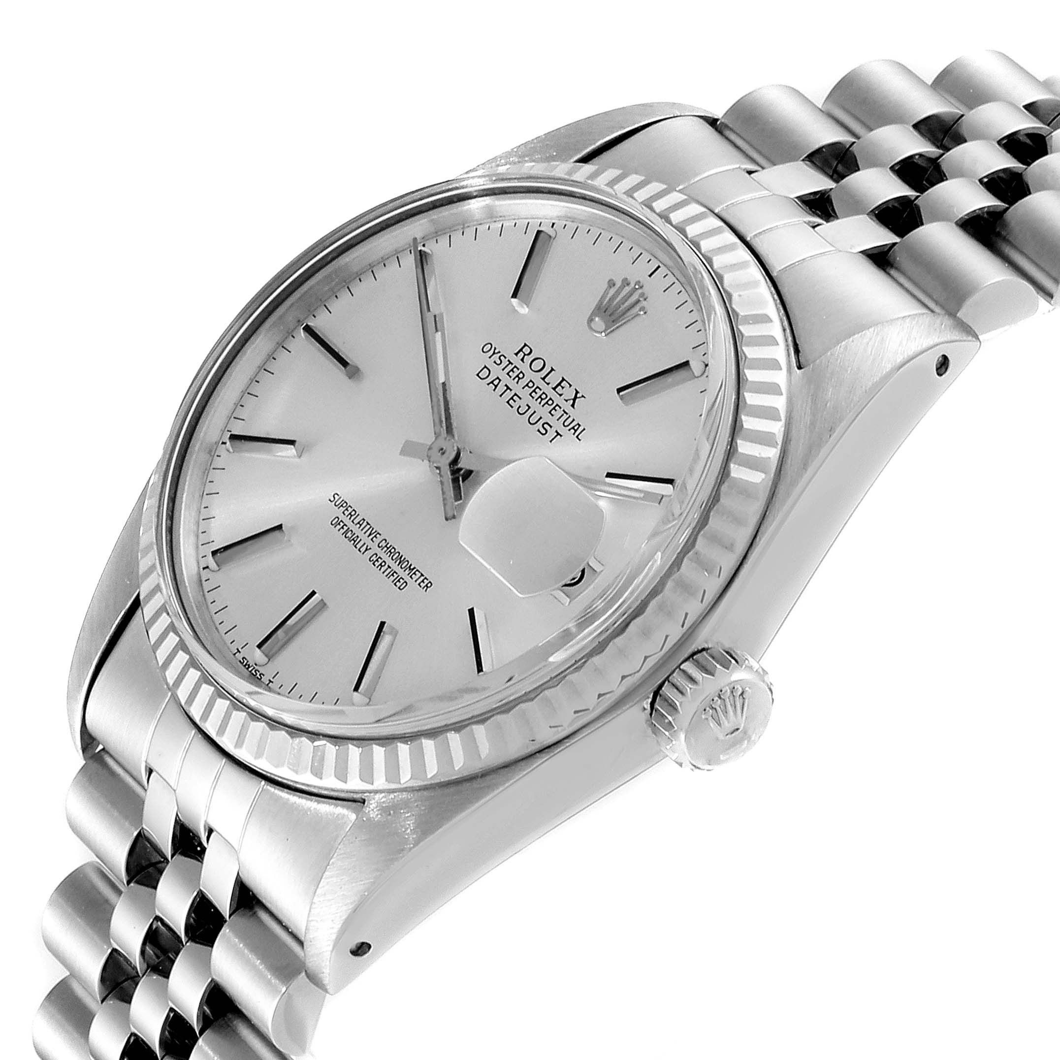 The image shows a Rolex Datejust 16014 Men
s Stainless Steel Silver Dial 16014 Men
s Stainless Steel Silver Dial watch angled to display the dial, bezel, and part of the bracelet, with a close-up of the crown and date magnifier.