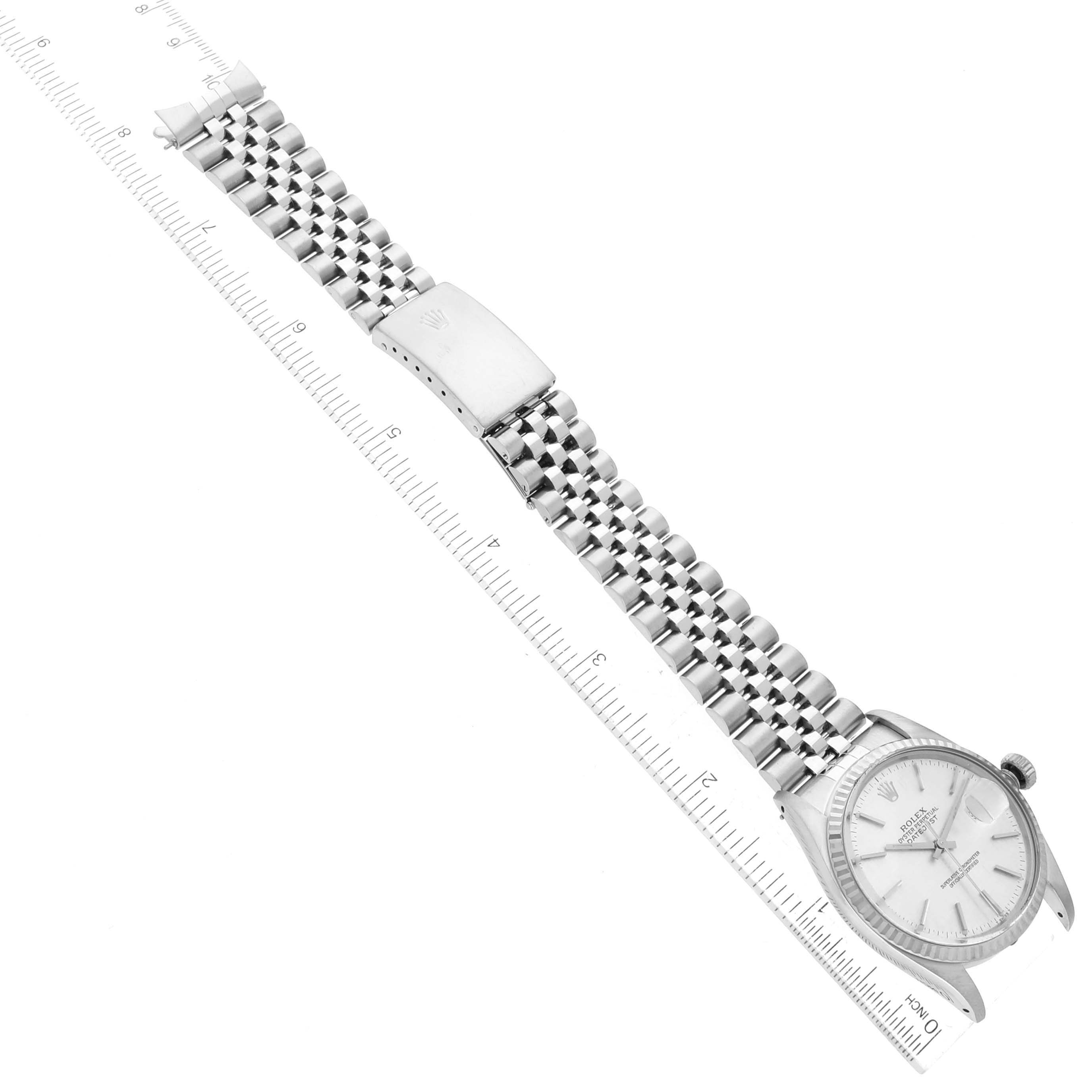 This image shows a Rolex Vintage Collection 16014 Men
s Stainless Steel Silver Dial 16014 Men
s Stainless Steel Silver Dial watch from a top-down perspective, illustrating the face and entire metal bracelet.