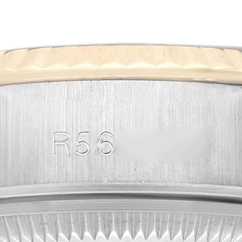 The image shows a close-up of the side of a Rolex Datejust 69173 Women's Steel and Gold (two tone) Black Dial 69173 Women's Steel and Gold (two tone) Black Dial, highlighting the edge of the bezel and part of the case with engravings.