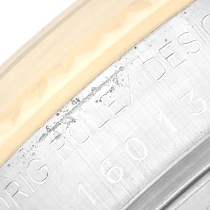 This close-up shows the engraved bezel of the Rolex Vintage Collection 16013 Men's Steel and Gold (two tone) Champagne Dial 16013 Men's Steel and Gold (two tone) Champagne Dial watch.