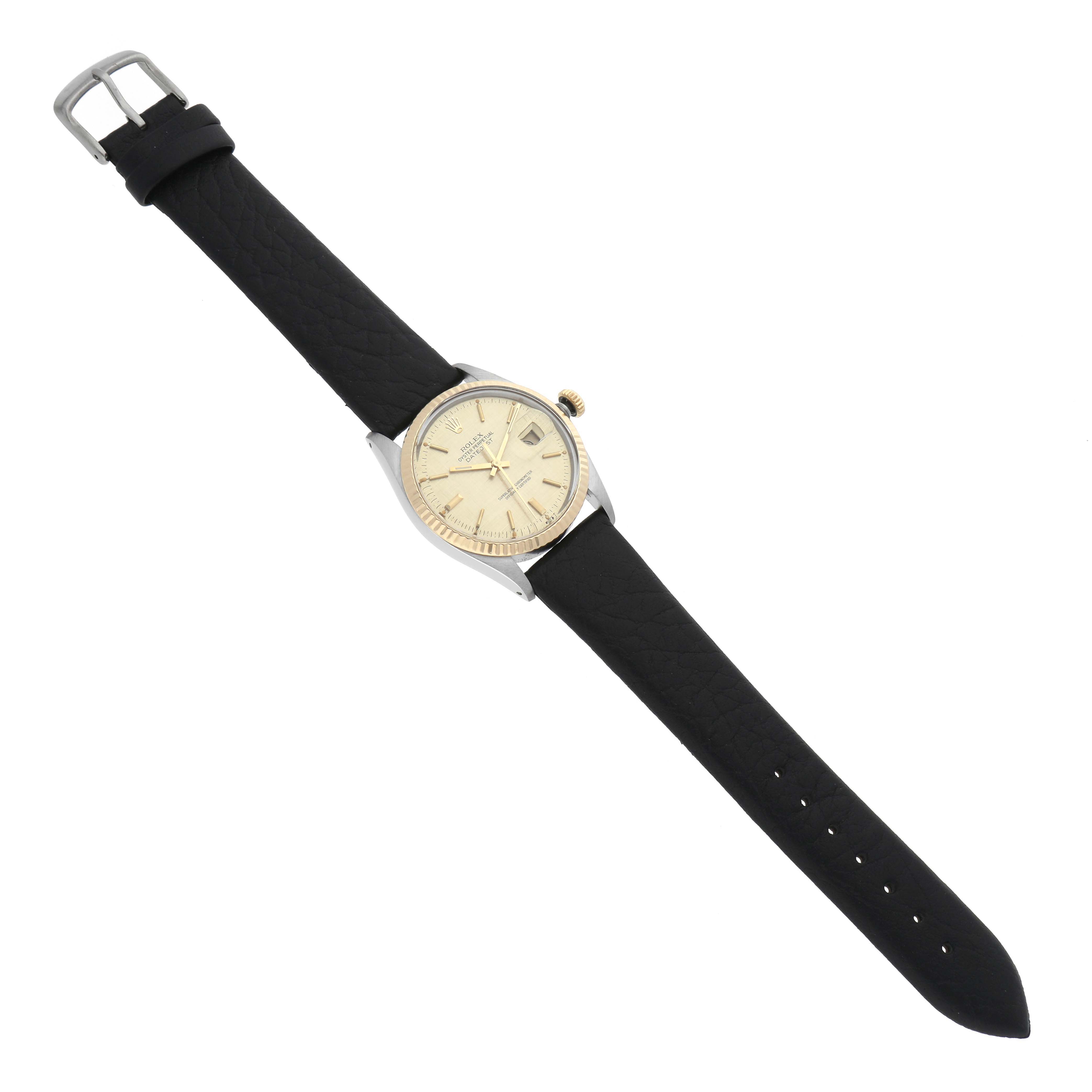 The image shows a top-down view of the Rolex Vintage Collection 16013 Men's Steel and Gold (two tone) Champagne Dial 16013 Men's Steel and Gold (two tone) Champagne Dial watch, displaying its black strap, round face, and buckle.