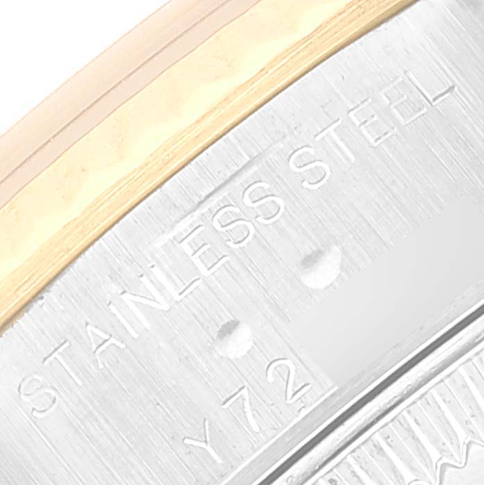 The image shows a close-up of the side of the bezel and case of a Rolex Datejust 79173 Women's Steel and Gold (two tone) Champagne Dial 79173 Women's Steel and Gold (two tone) Champagne Dial watch, highlighting the "Stainless Steel" engraving.