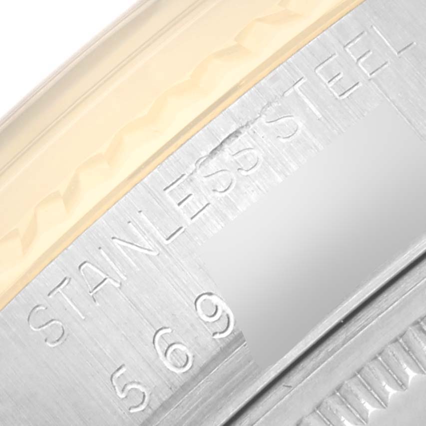 The image shows an extreme close-up of the case engravings on a stainless steel Rolex Vintage Collection 16013 Men's Steel and Gold (two tone) Champagne Dial 16013 Men's Steel and Gold (two tone) Champagne Dial model watch.