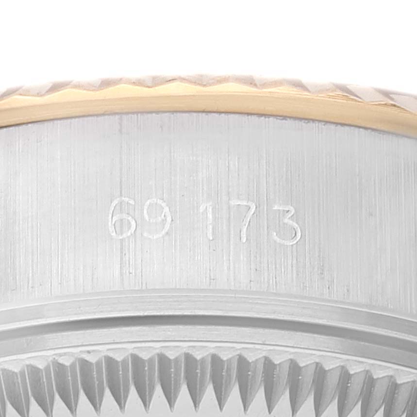 This close-up image shows the model number "69173" engraved on the side of a Rolex Datejust 69173 Women's Steel and Gold (two tone) White Dial 69173 Women's Steel and Gold (two tone) White Dial watch case.