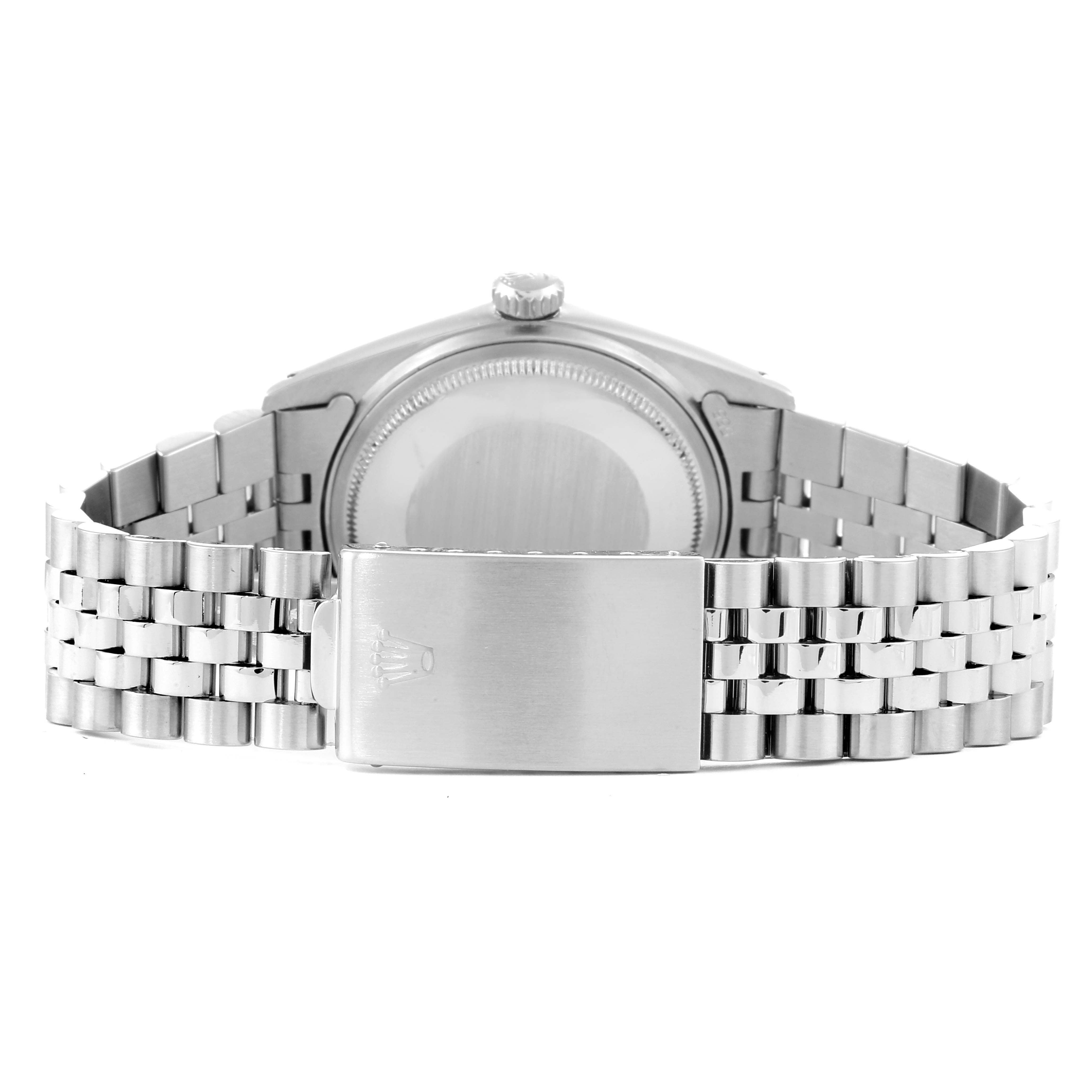 The image shows the back view of the Rolex Vintage Collection 16014 Men
s Stainless Steel Black Dial 16014 Men
s Stainless Steel Black Dial watch, focusing on the case back and metal bracelet clasp.